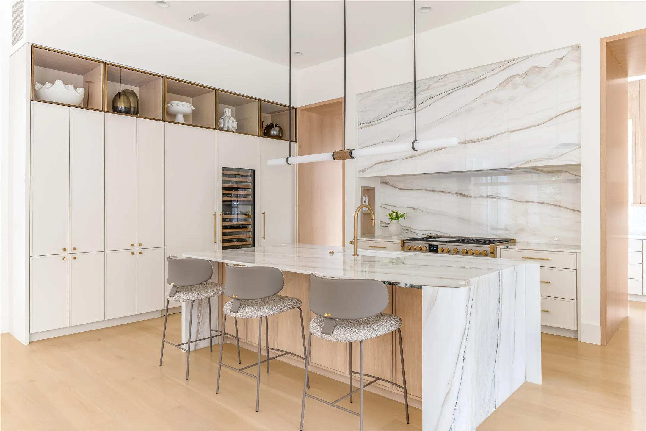 Gourmet eat-in kitchen with custom marble countertop and top-tier appliances
