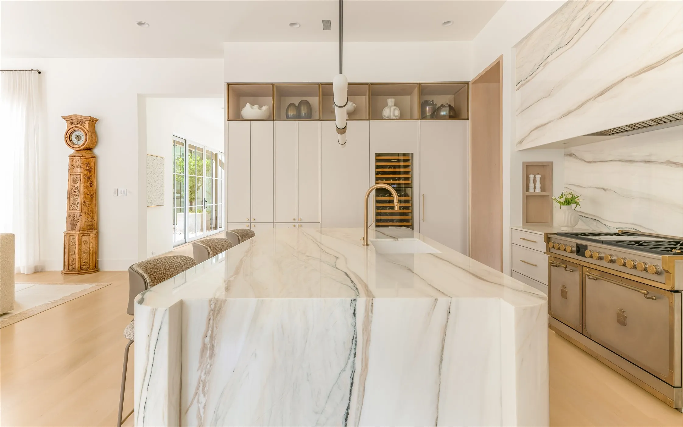 Gourmet eat-in kitchen with custom marble countertop and top-tier appliances