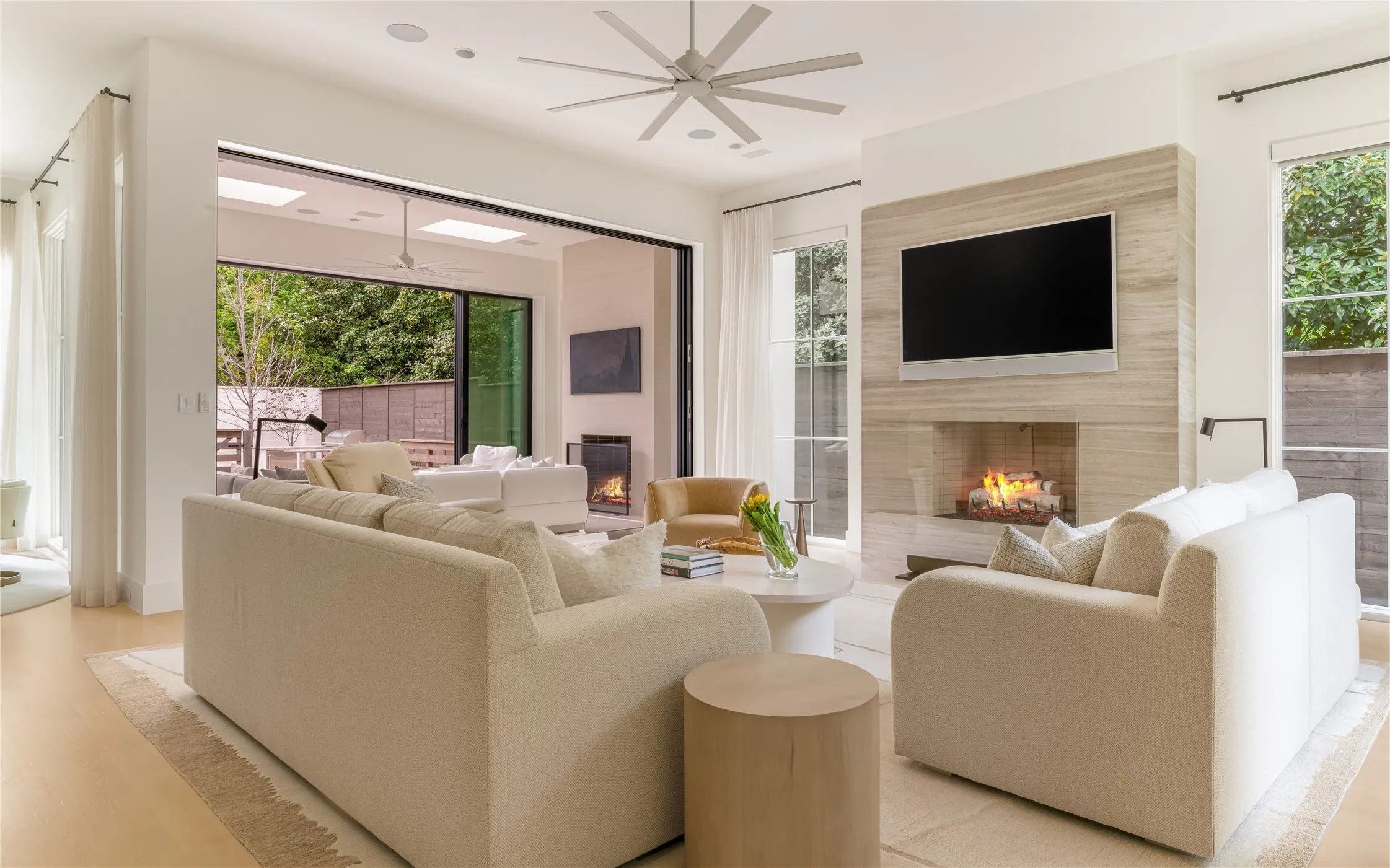 Family Room with Isokern gas fireplace and sliding doors to sunroom