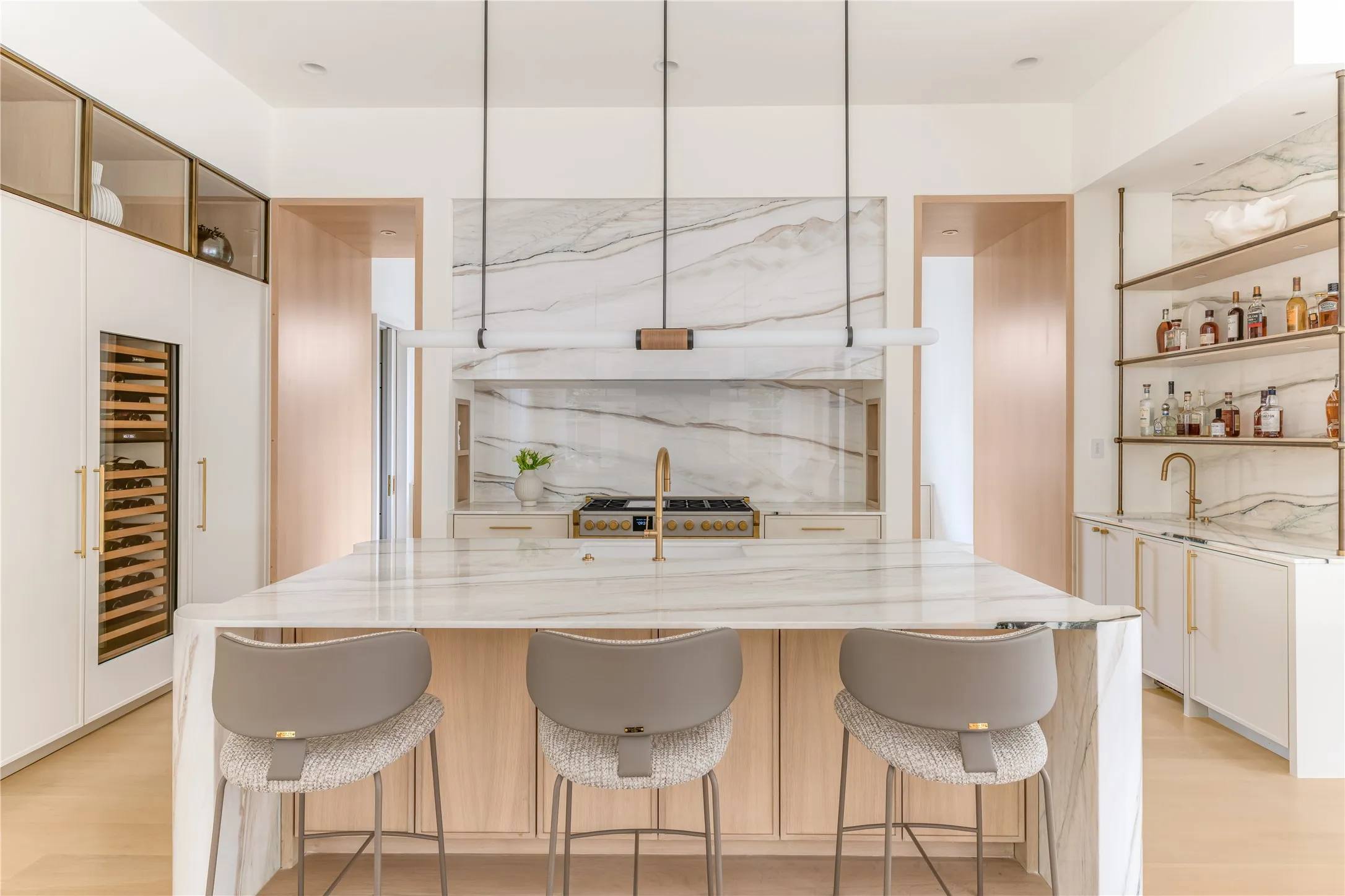 Gourmet eat-in kitchen with custom marble countertop and top-tier appliances