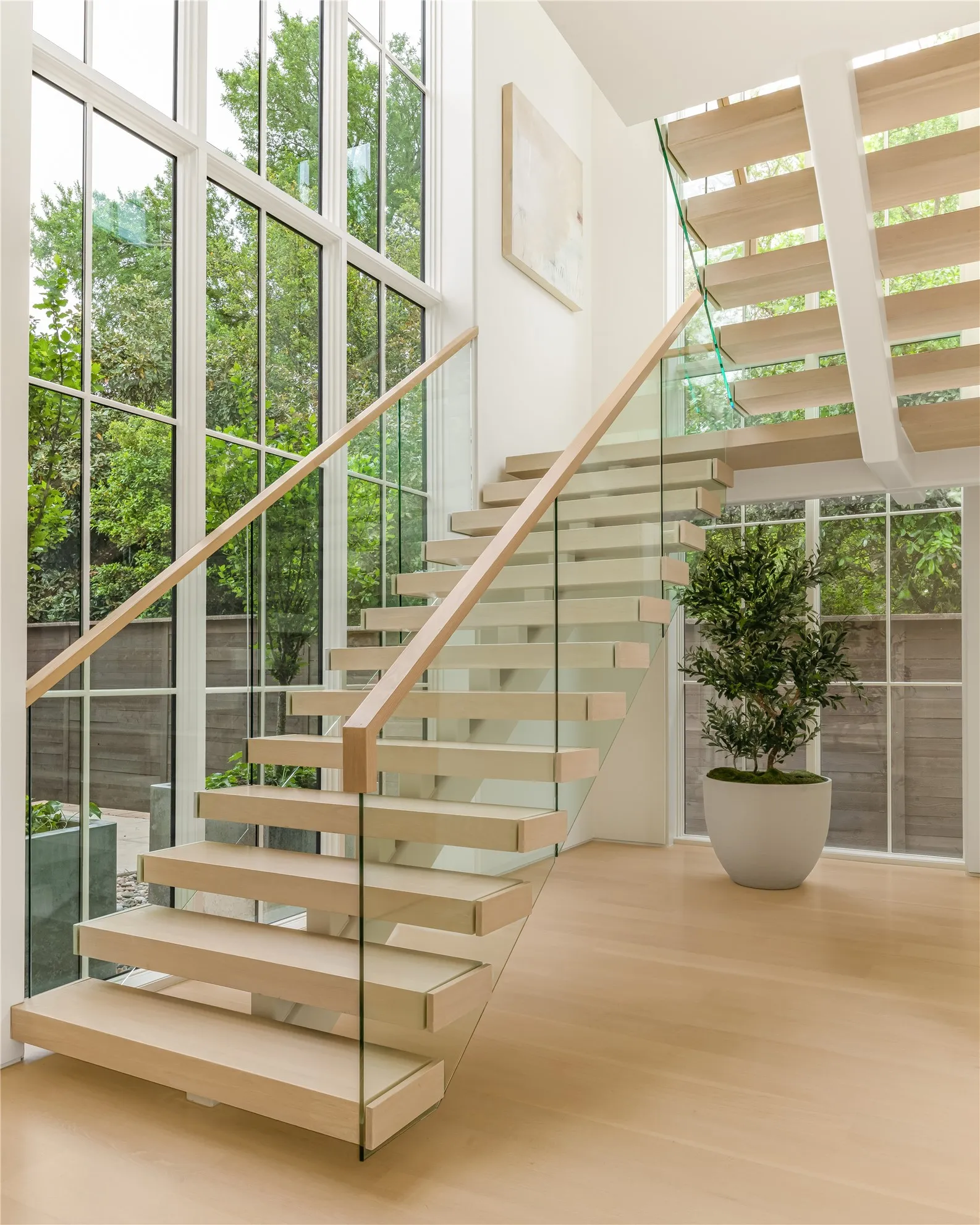 Entry with white oak floating staircase