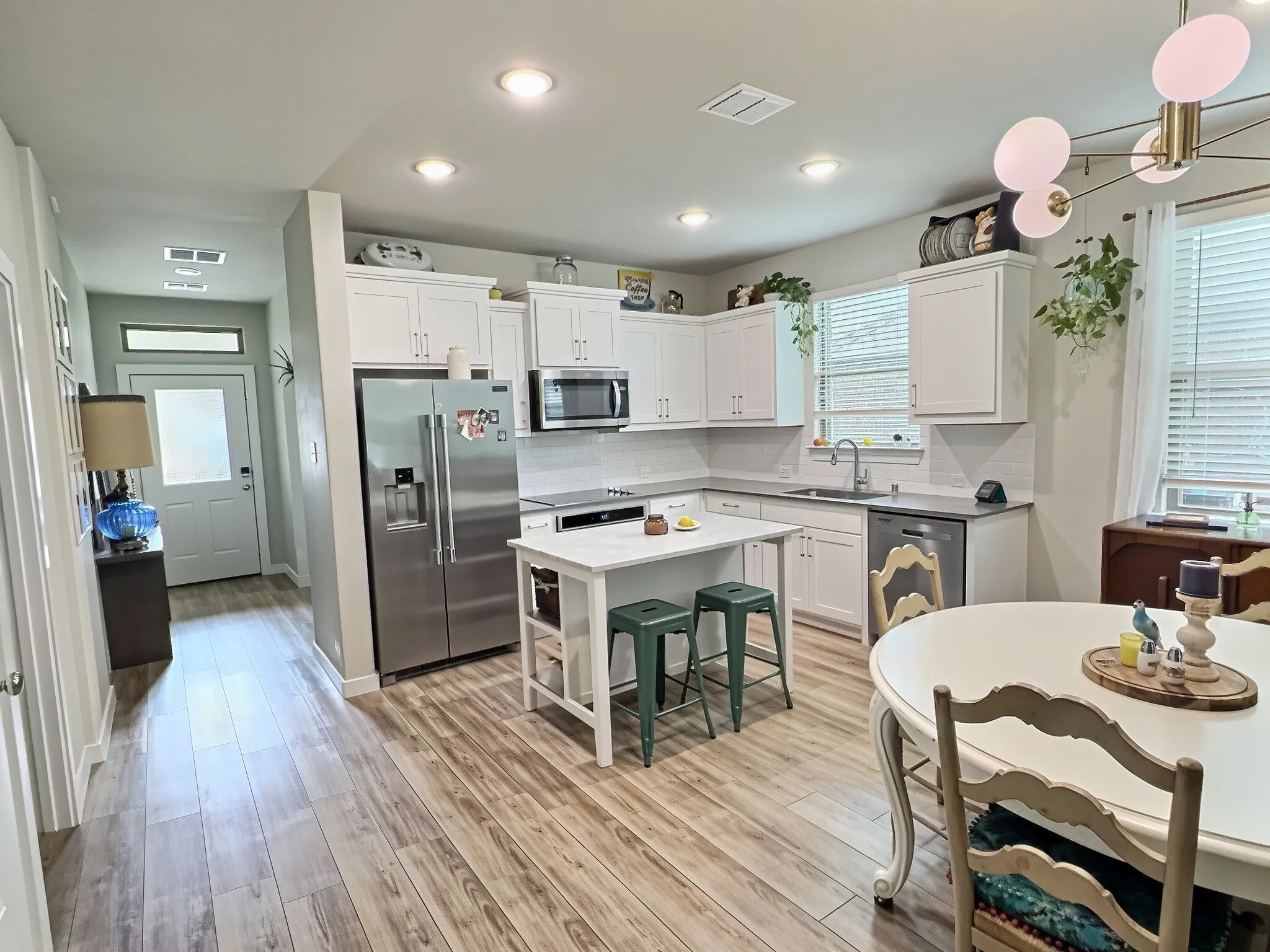 Open floorplan with marble island with eat in kitchen