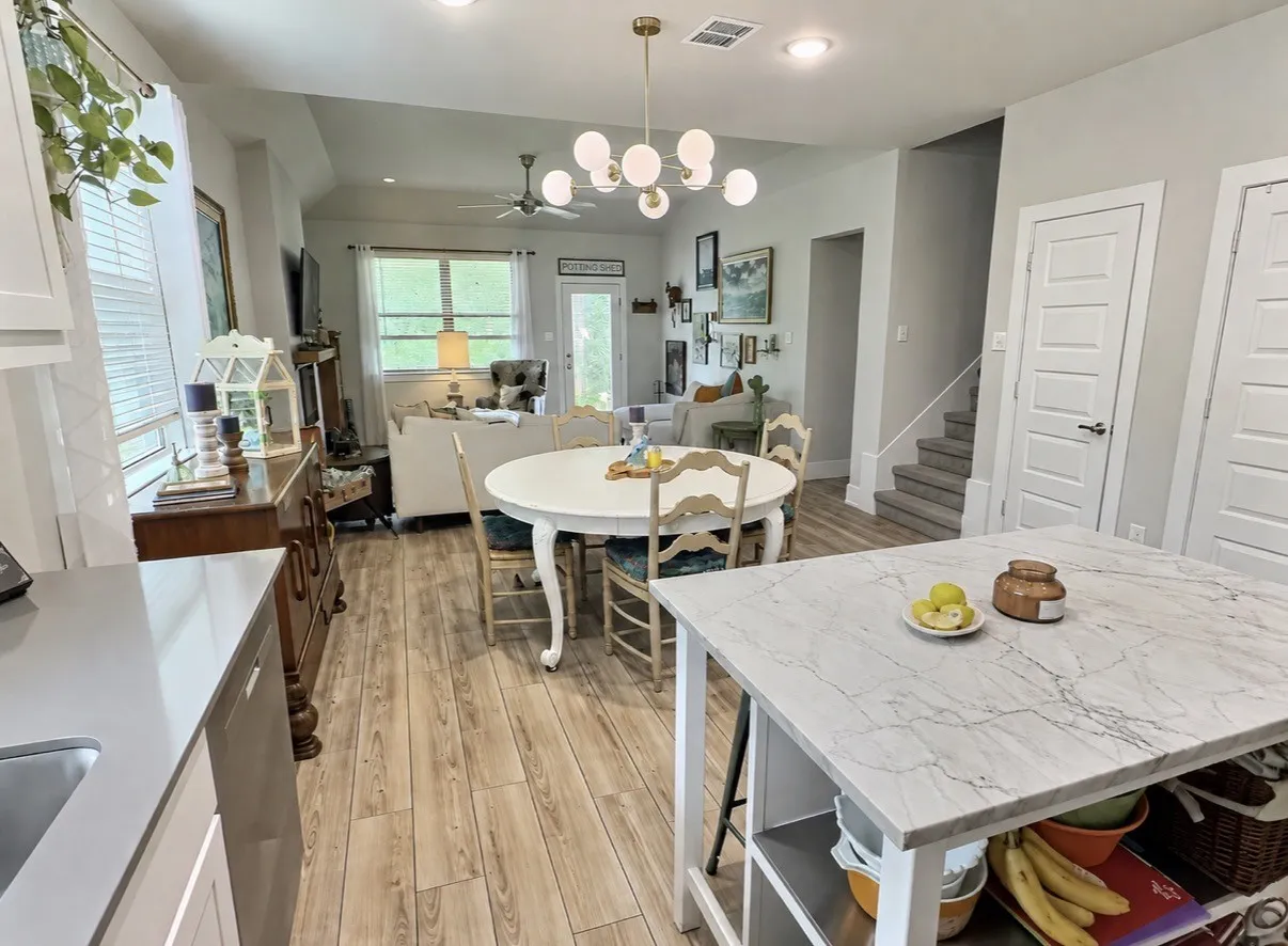 Open floorplan with marble island with seating