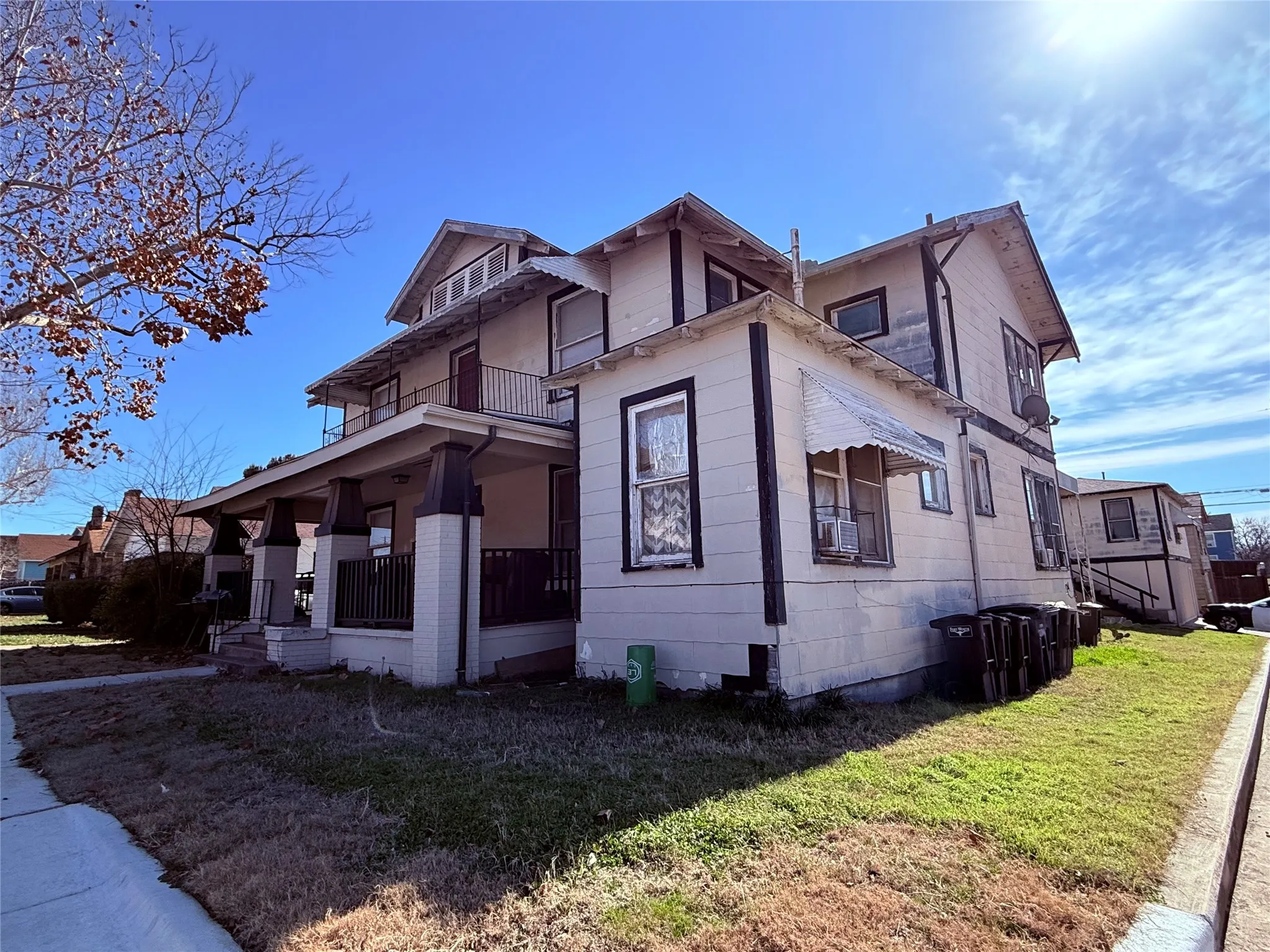 View of property exterior featuring cooling unit and a lawn