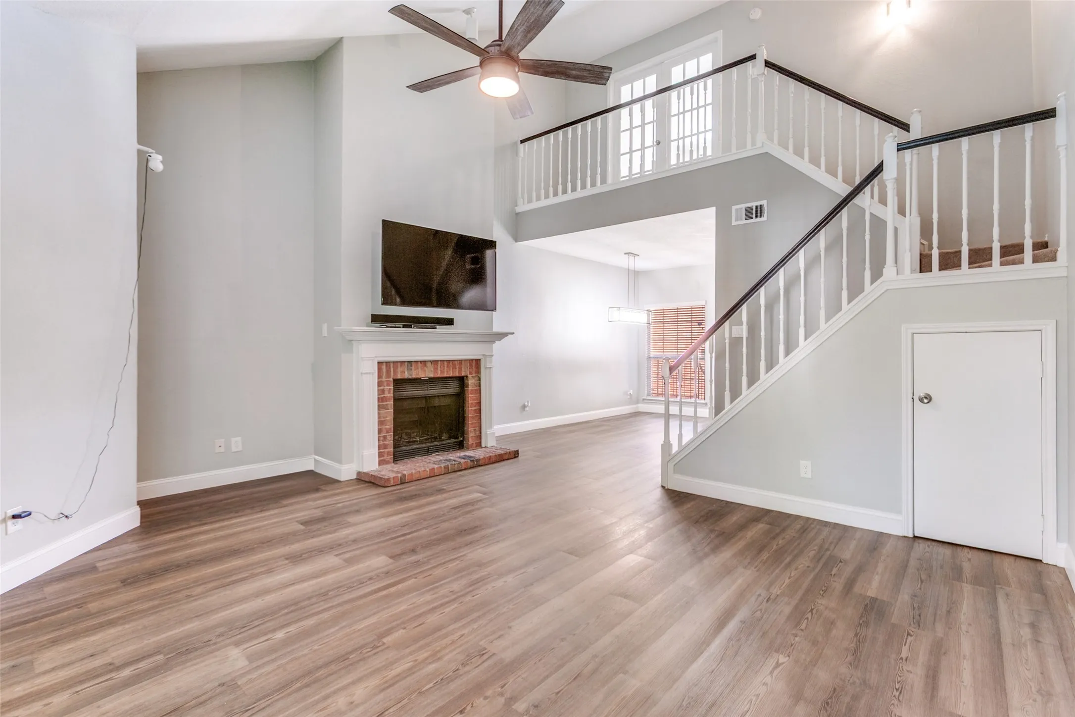 View of living room and dining area from nortwest corner.