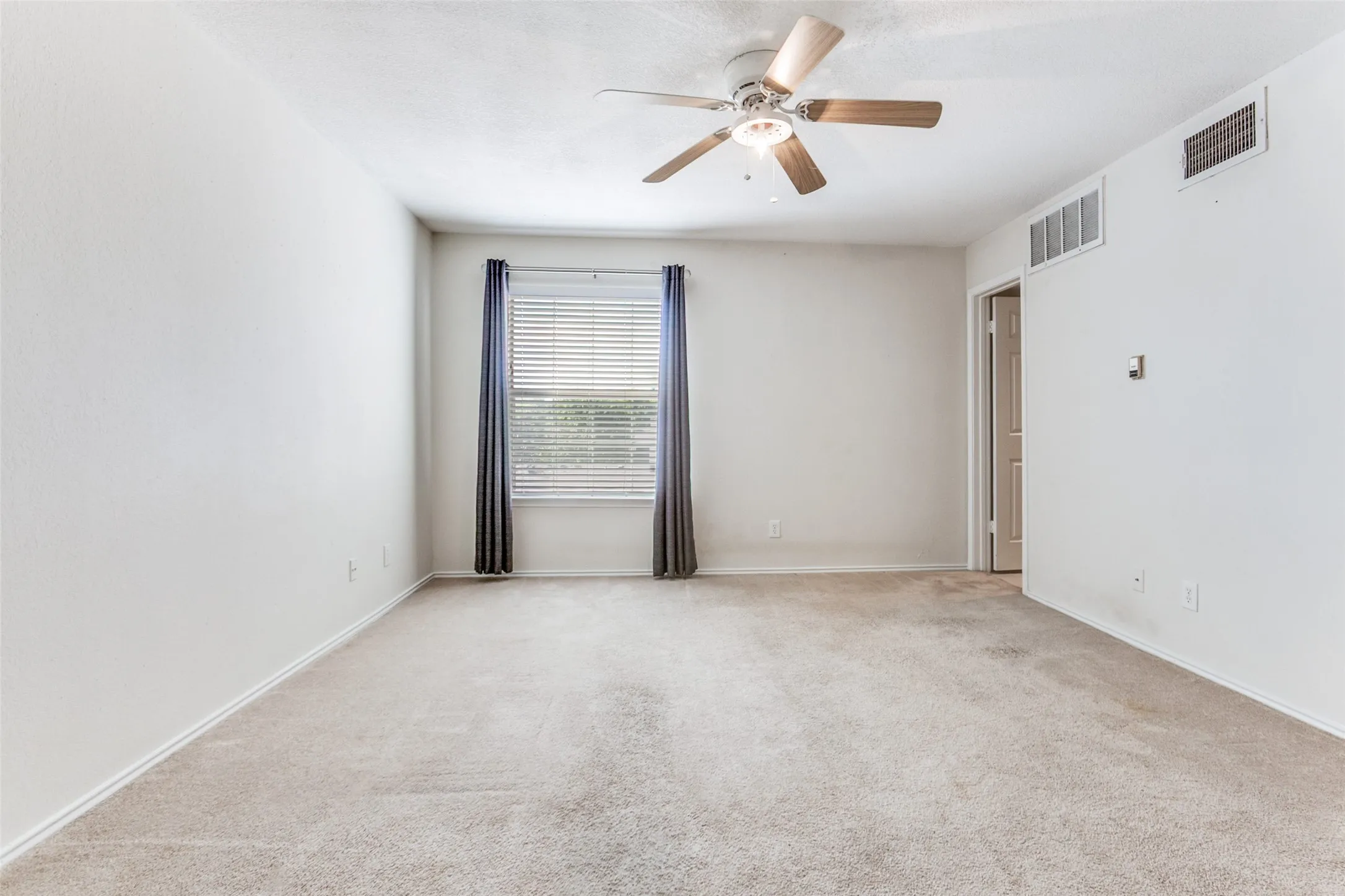 View from doorway of scondary bedroom on the second level