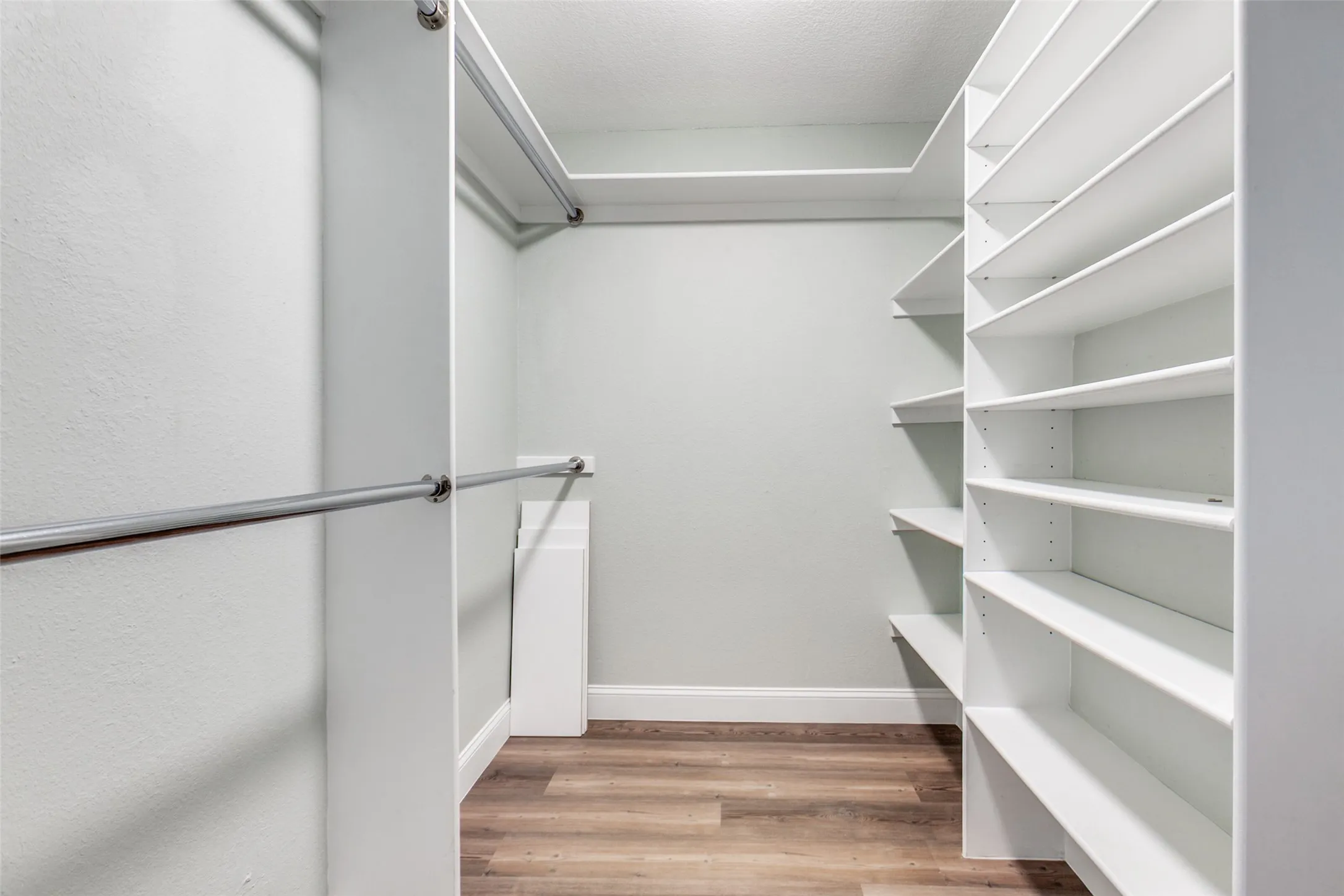 View of closet in primary bedroom