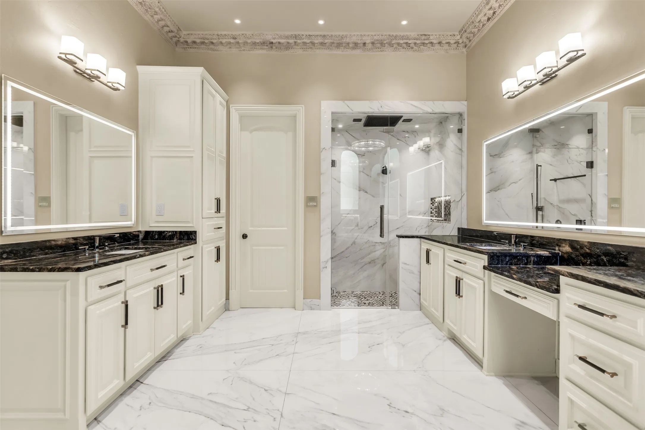 Gorgeous upgraded master suite with towel warmer, steam shower, and custom closet.