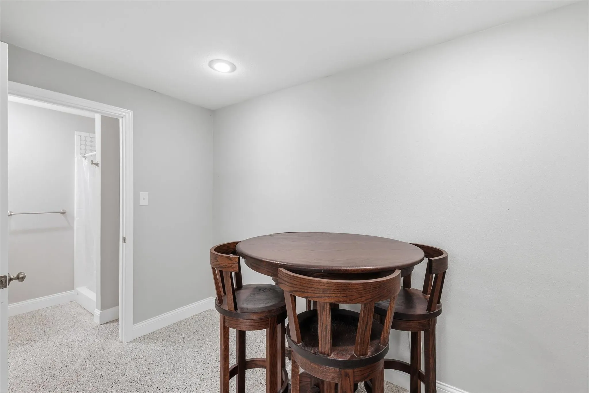 Off the kitchen and dining space is the full bathroom with shower