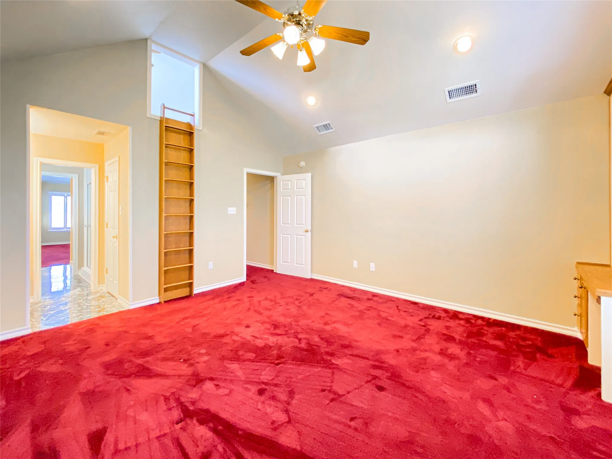 Bedroom 4 with a high ceiling, a ceiling fan, and carpet floors