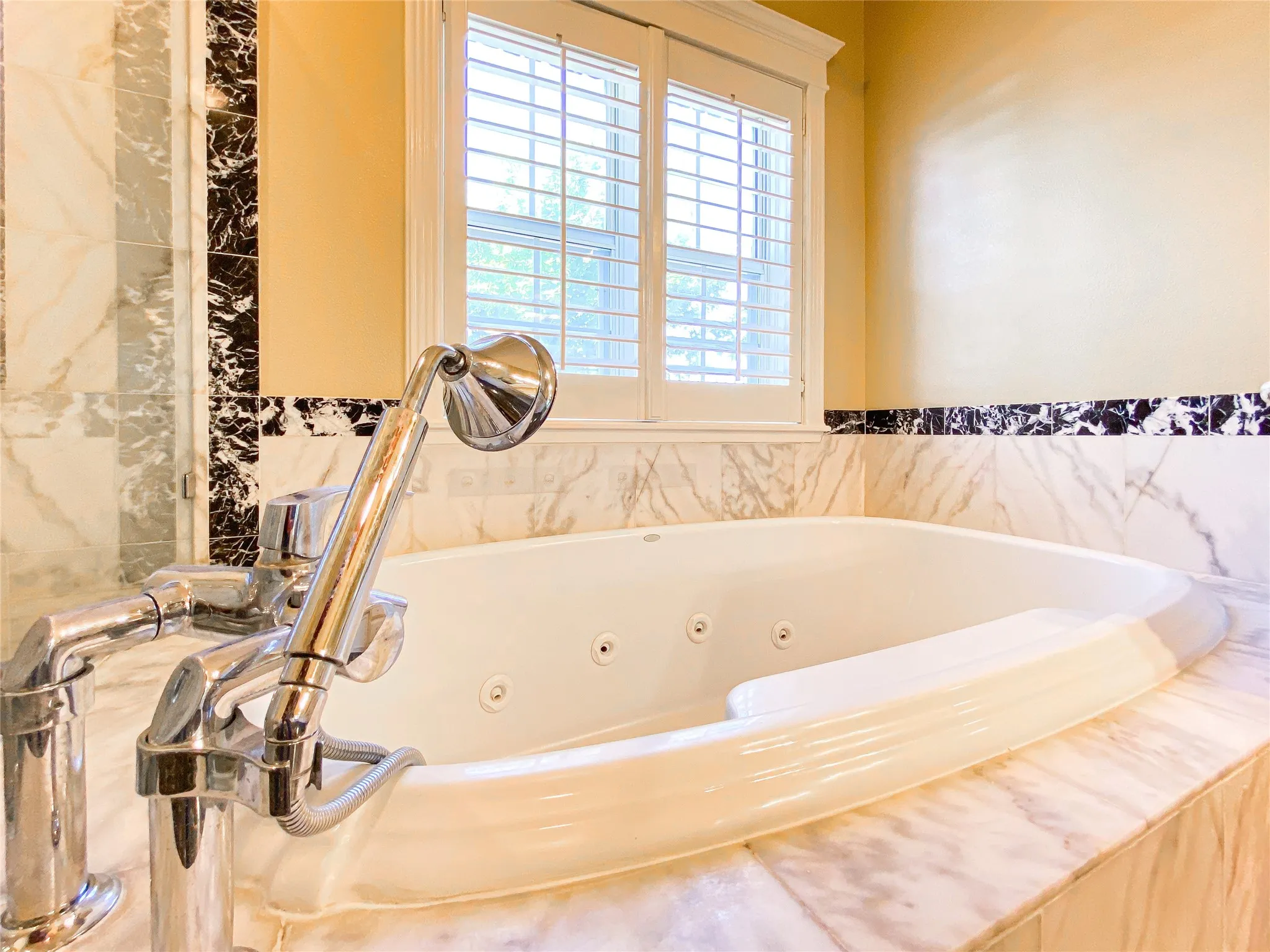 PRIMARY bath with a jetted tub