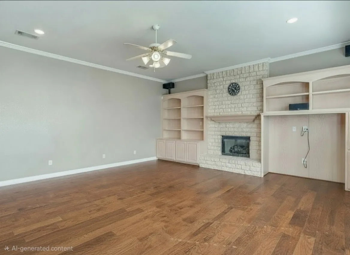 Living room with AI updated paint, to be completed 7/29 Spacious interior featuring wood-finish flooring, a brick fireplace with a mantel, and built-in cabinetry