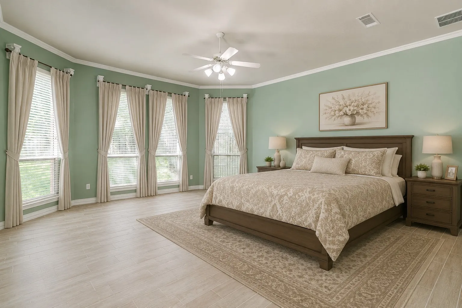AI generated for furniture placement. Spacious room featuring multiple large windows with blinds, light green wall paint, crisp white crown molding, and wood-finish tile flooring