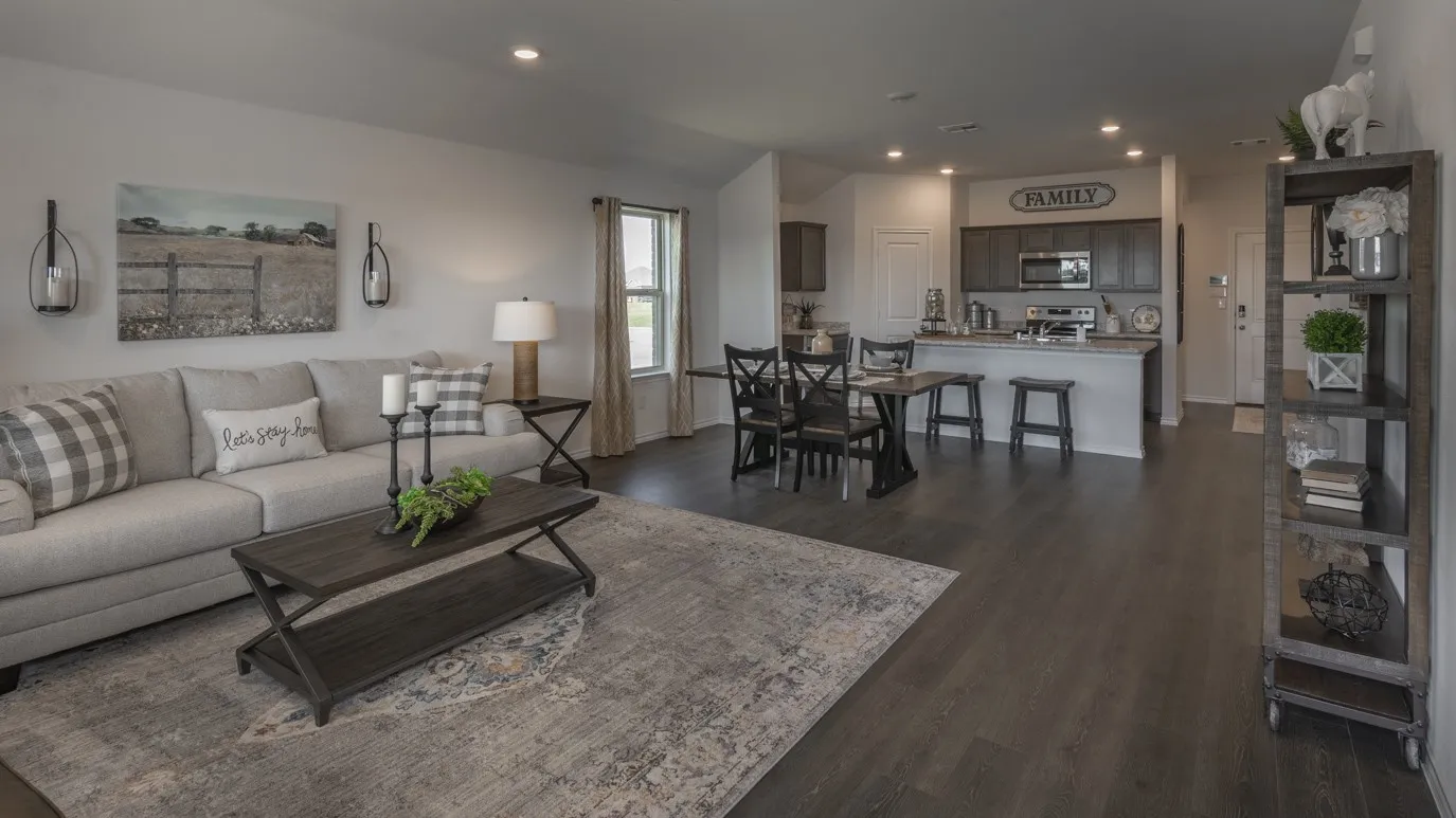Living area featuring recessed lighting and dark wood-type flooring