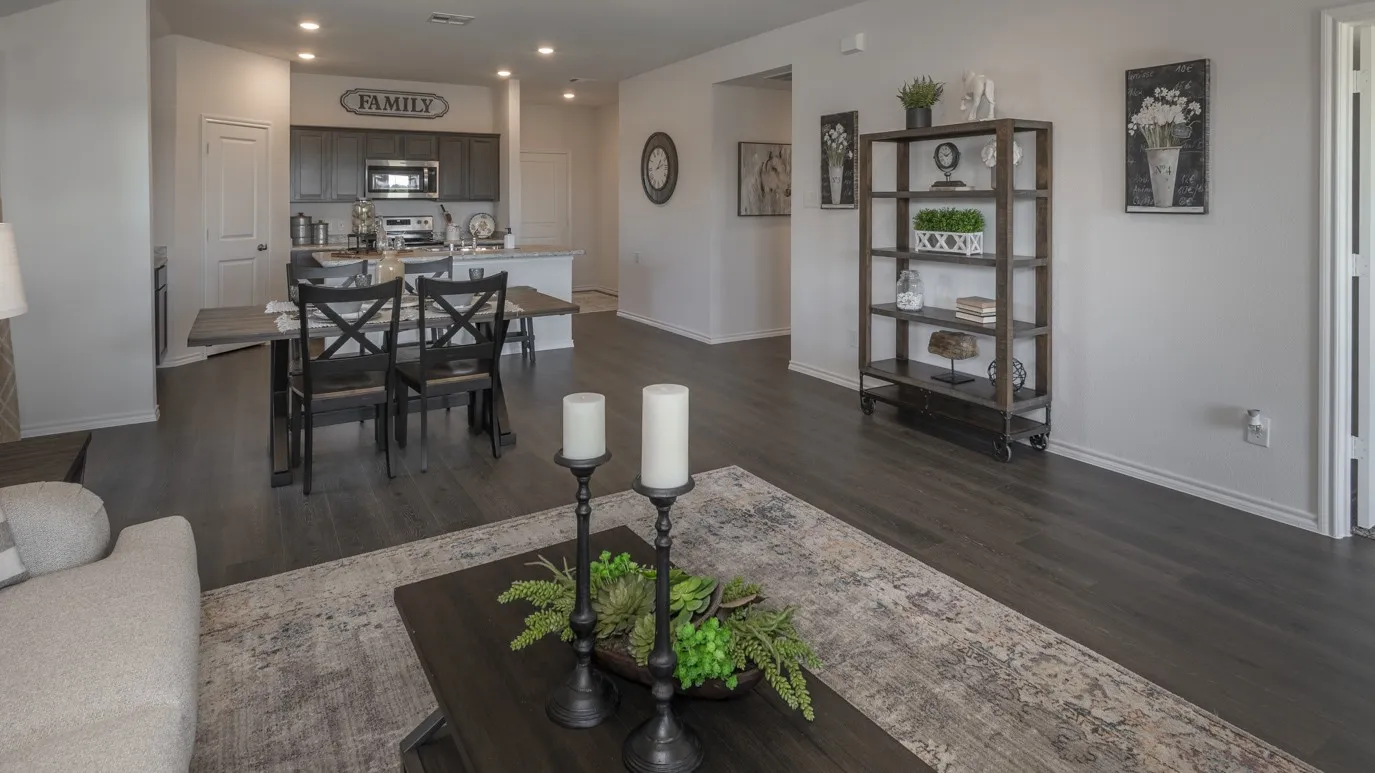 Living room with recessed lighting and dark wood-type flooring
