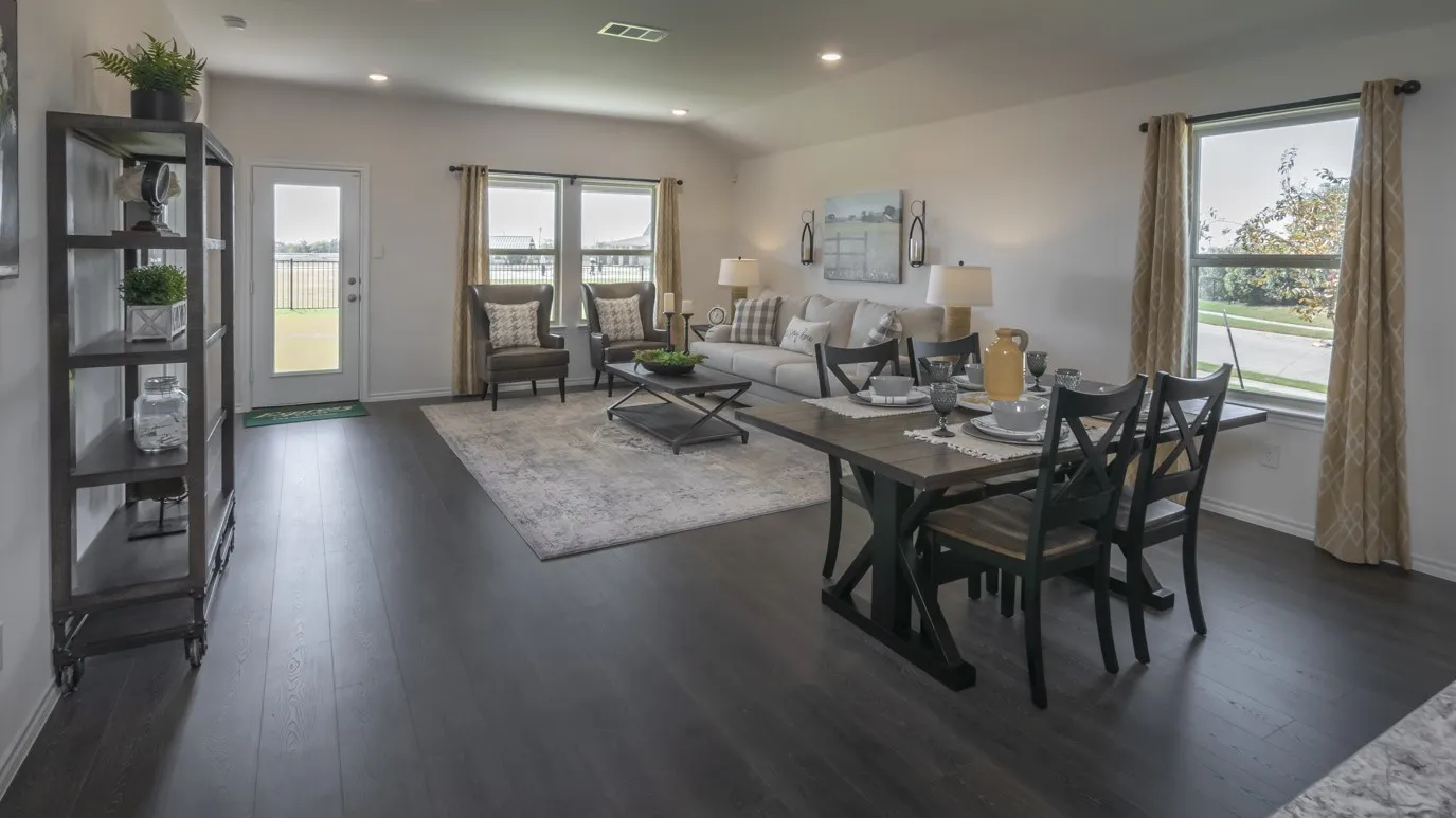Dining area featuring dark wood-type flooring and recessed lighting