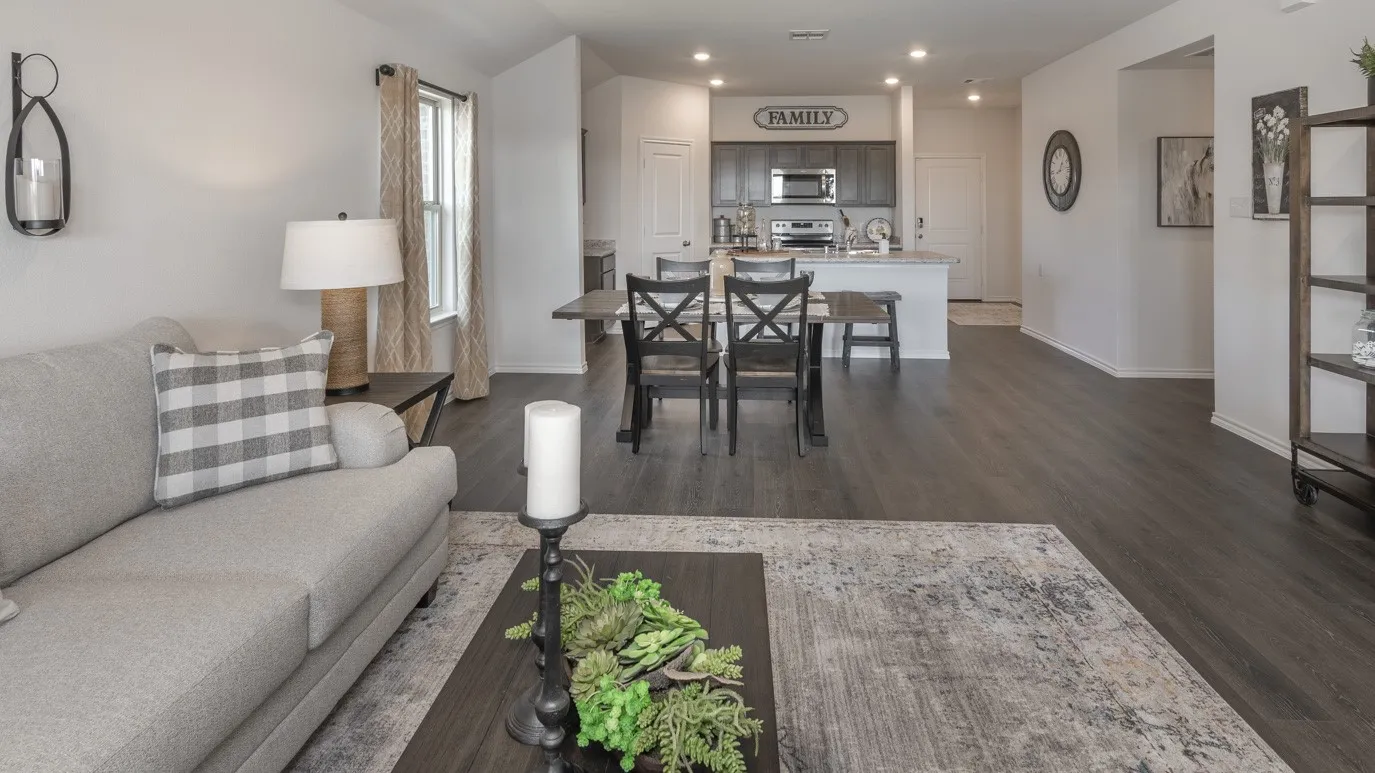 Living room featuring recessed lighting and dark wood-type flooring