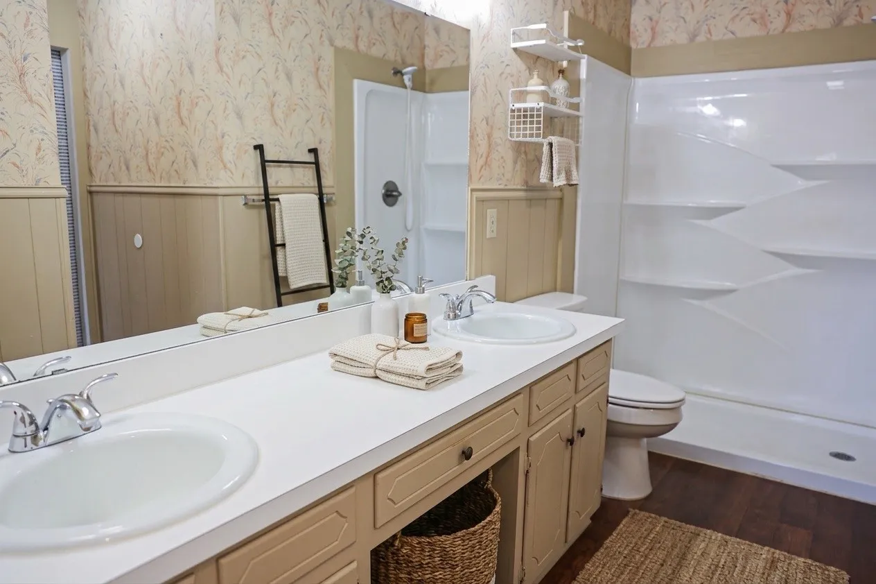 Double vanity with integrated sinks, chrome faucets, and ample countertop space