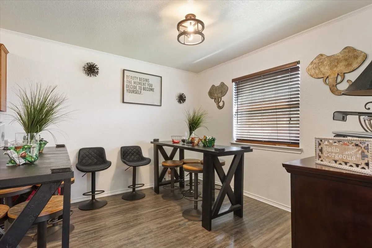 Dining area with dark wood finished floors and a textured ceiling