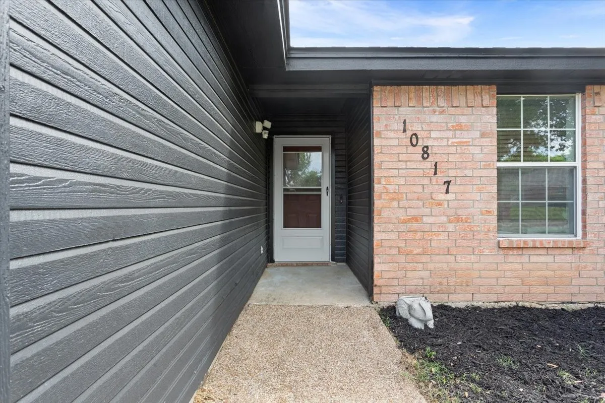Property entrance with brick siding