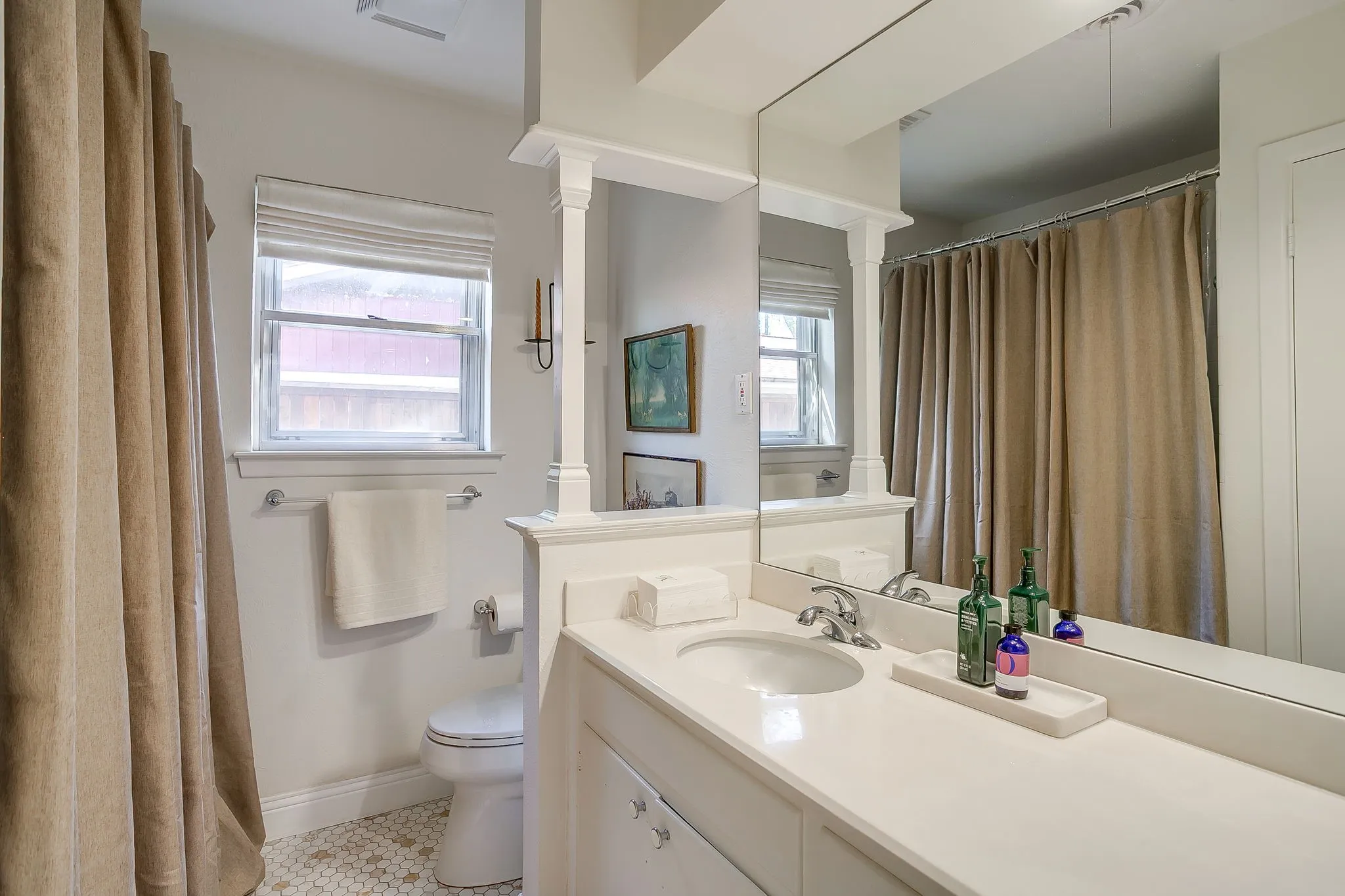 Hall bath with updated tile.