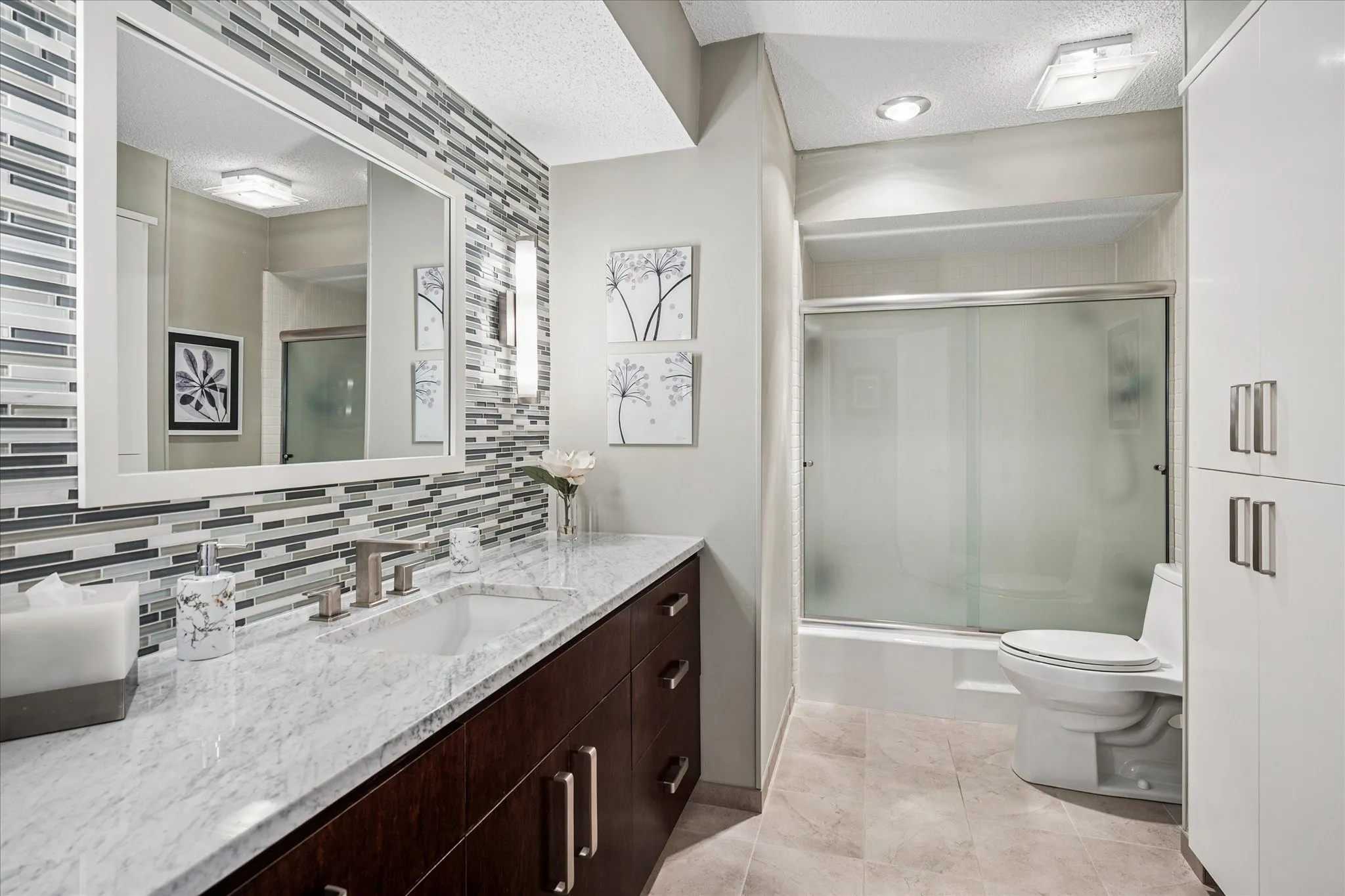 This bathroom was also completely remodeled with very tasteful finishes.