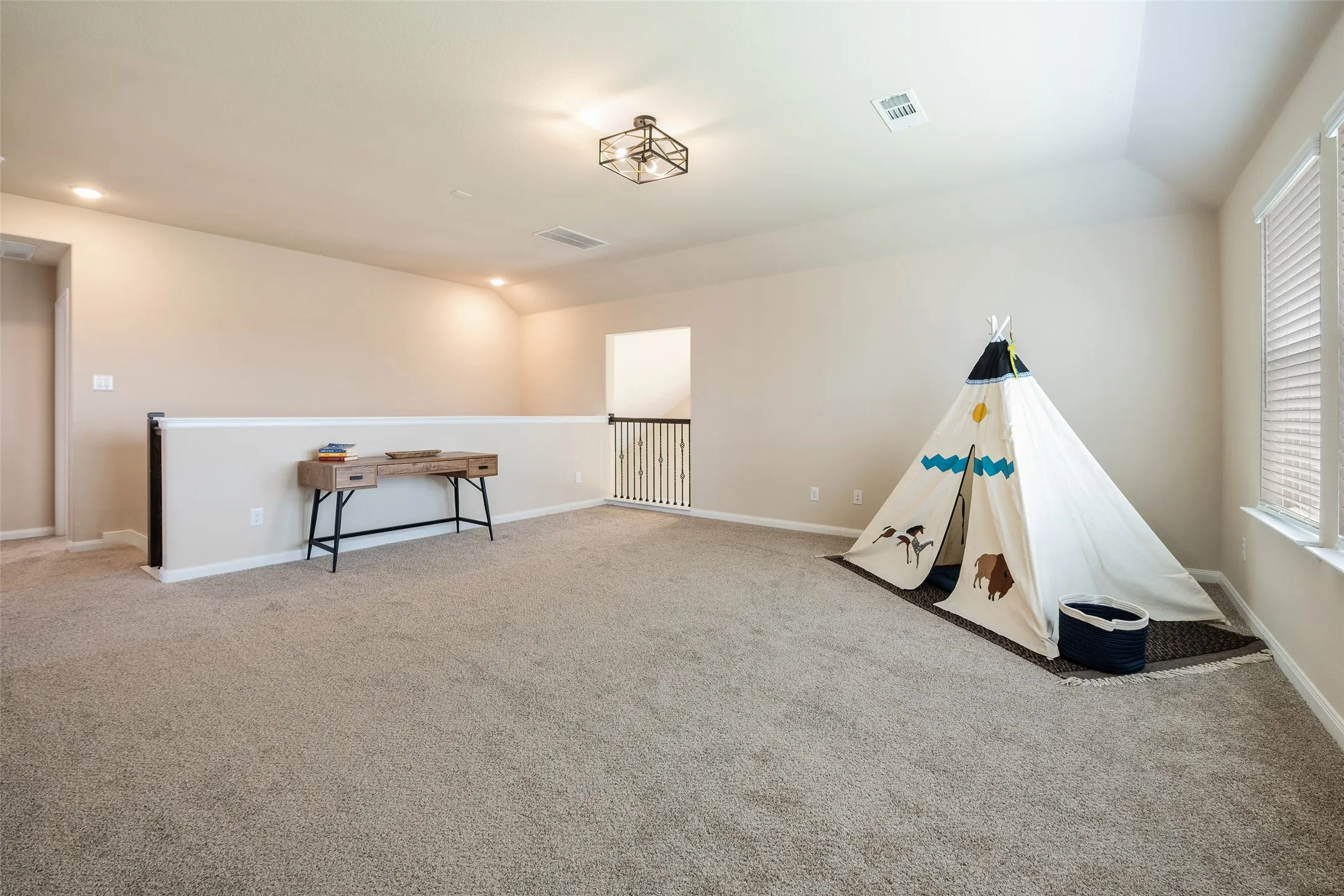Large second-floor game room with new carpet, paint, and windows overlooking the golf course and yard!