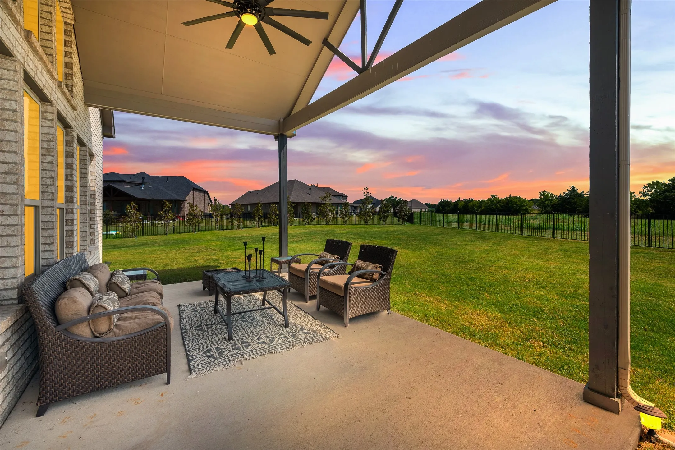Enjoy evening shade on the large covered patio which overlooks the yard and future golf course!