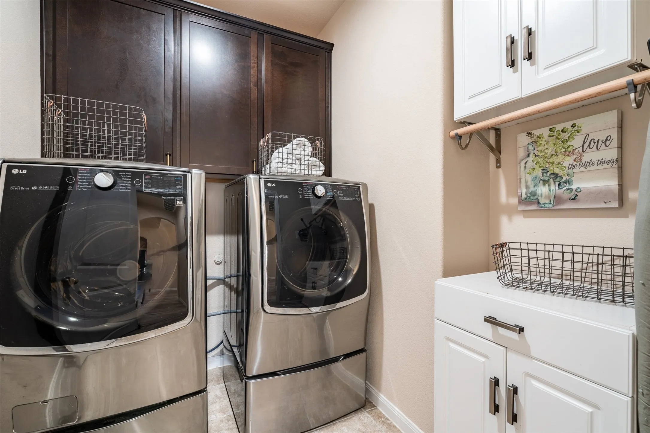 Great-sized laundry room on the first floor with built-in cabinets