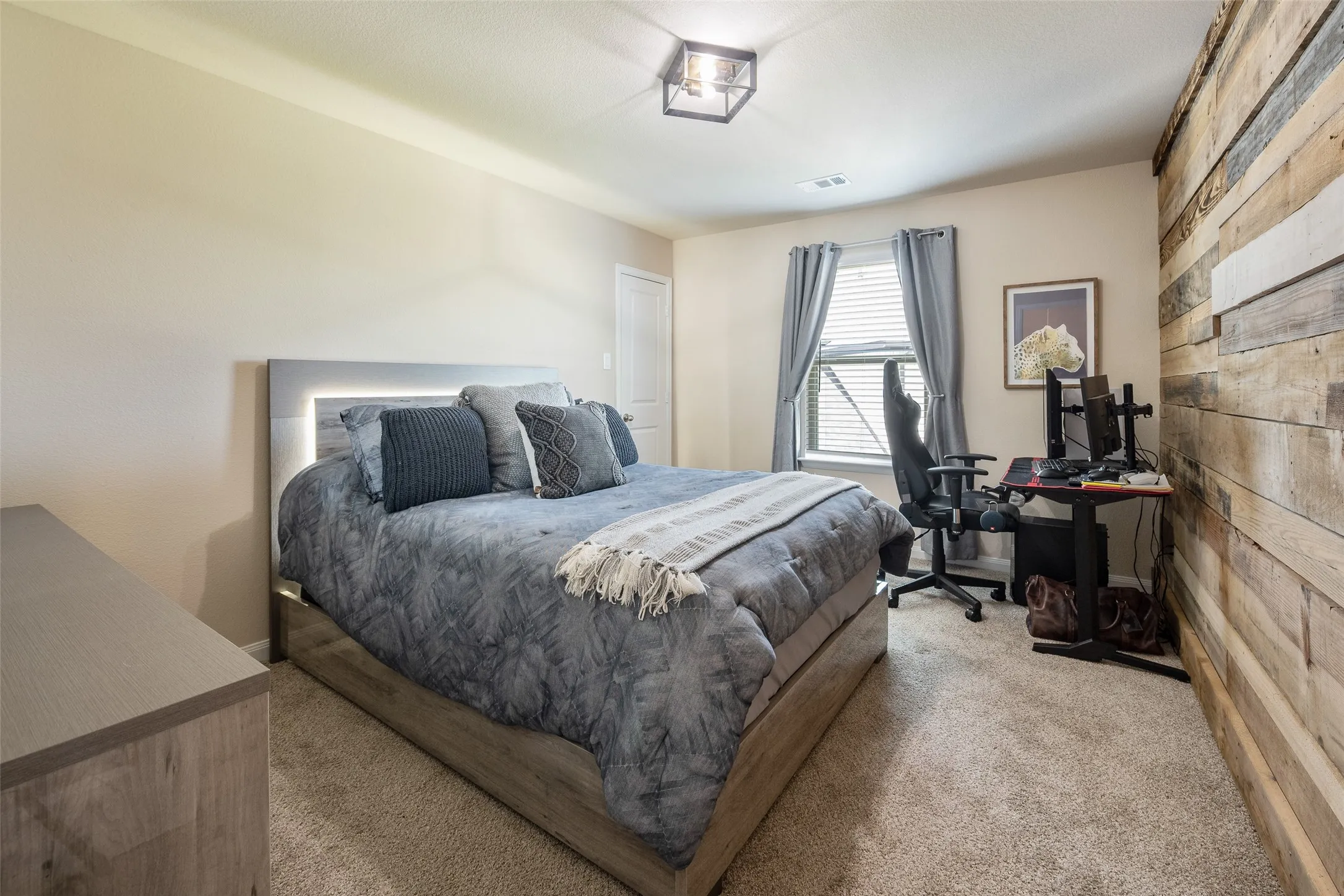 Bedroom #5 with a custom wood accent wall