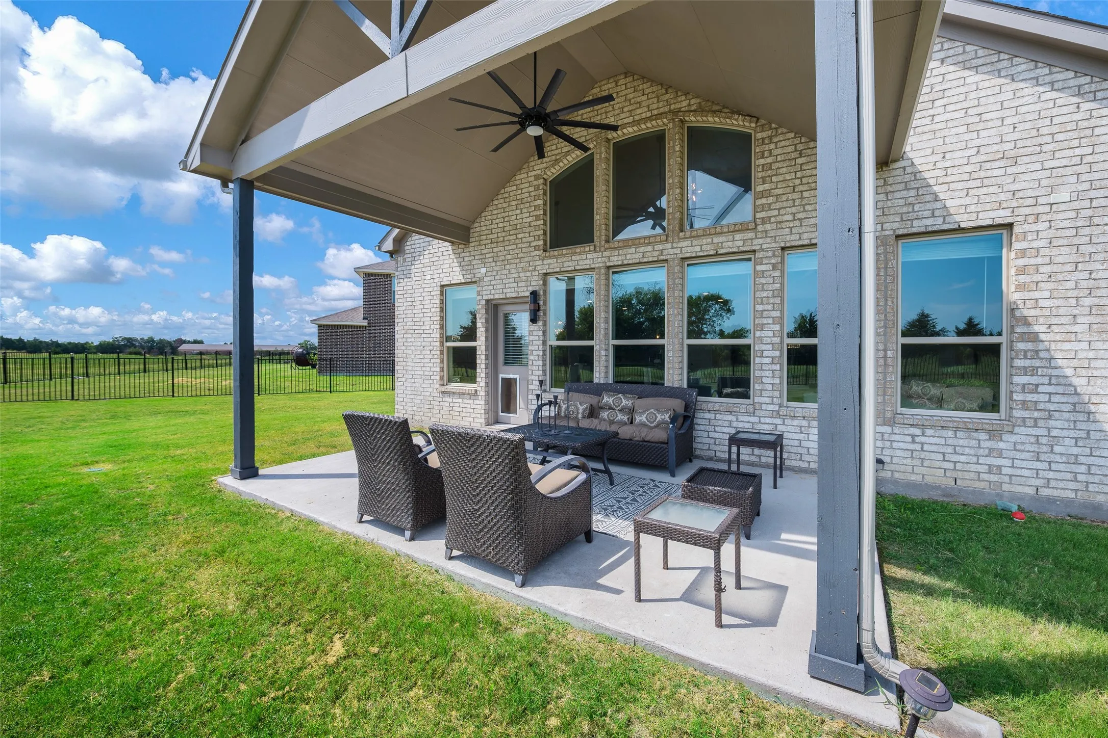 Enjoy evening shade on the large covered patio which overlooks the yard and future golf course!