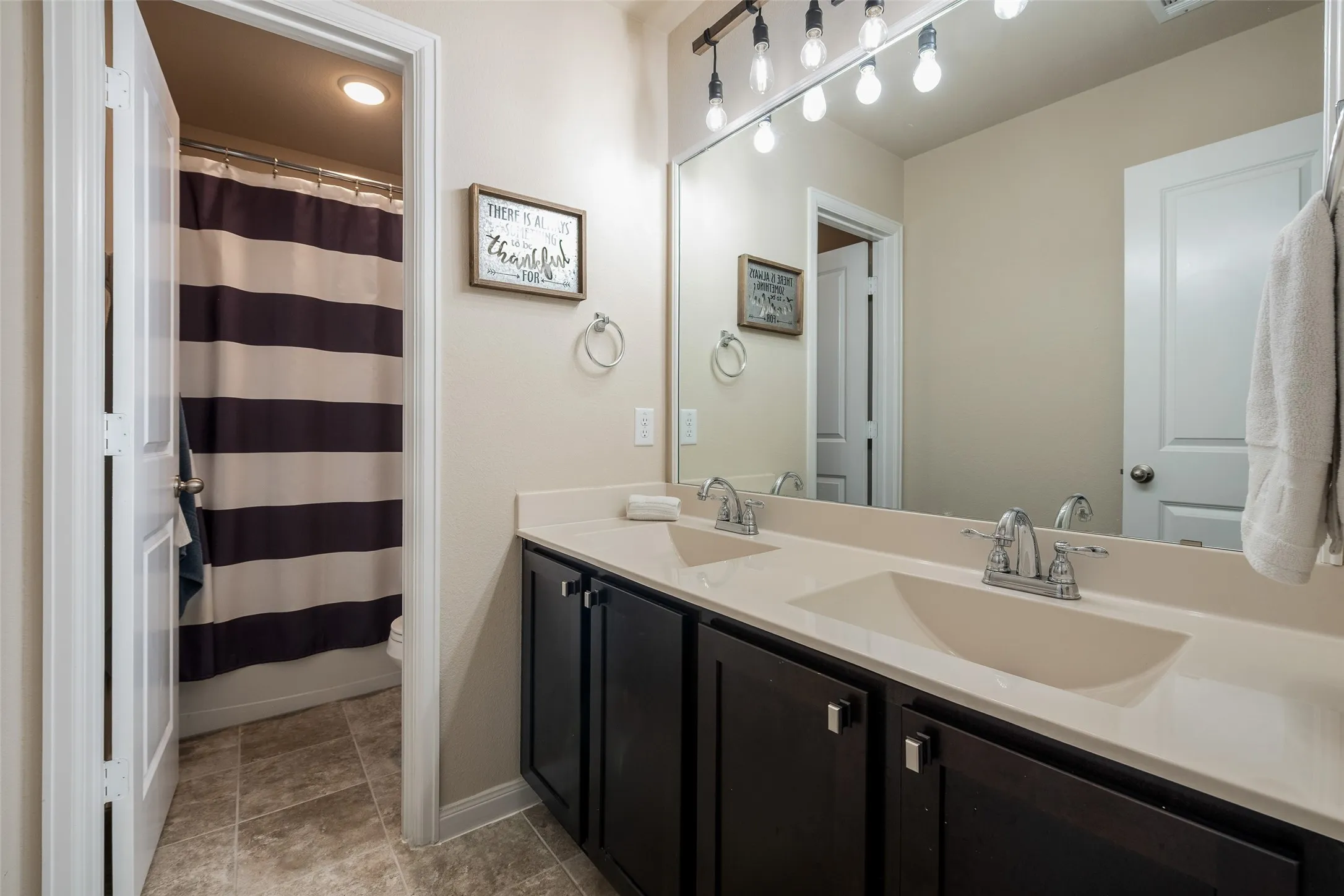 Bathroom #4 located upstairs separating the media room and bedroom #5