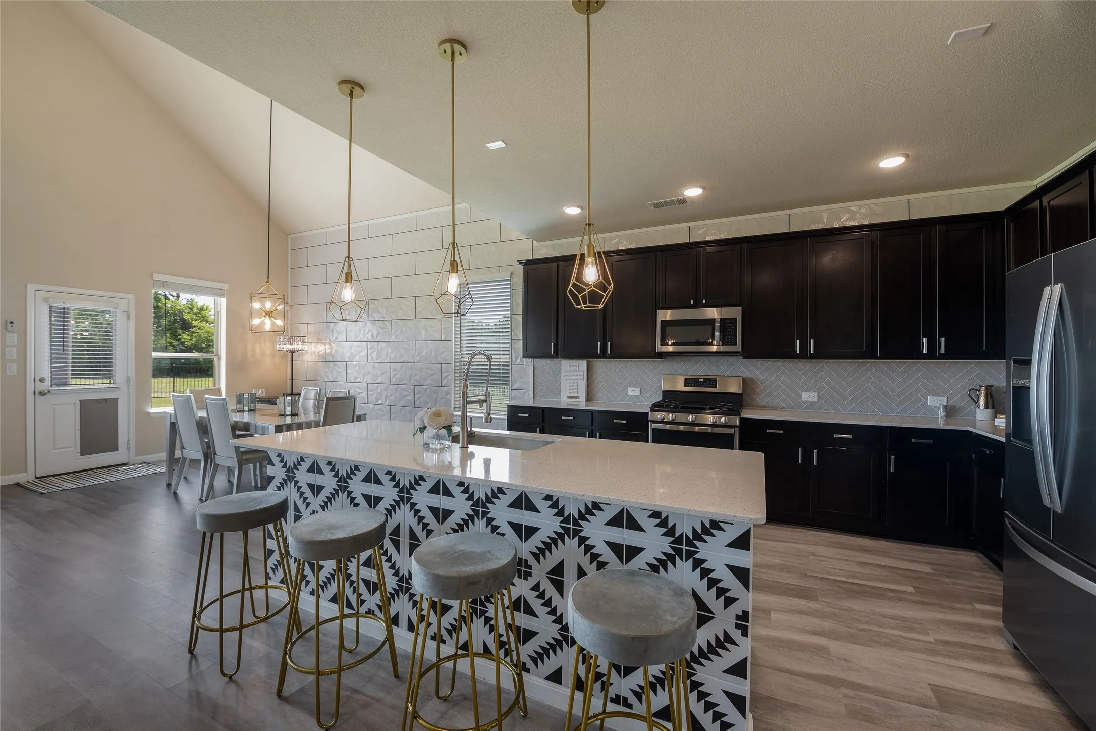 Stunning designer tile addes in kitchen on wall and island!