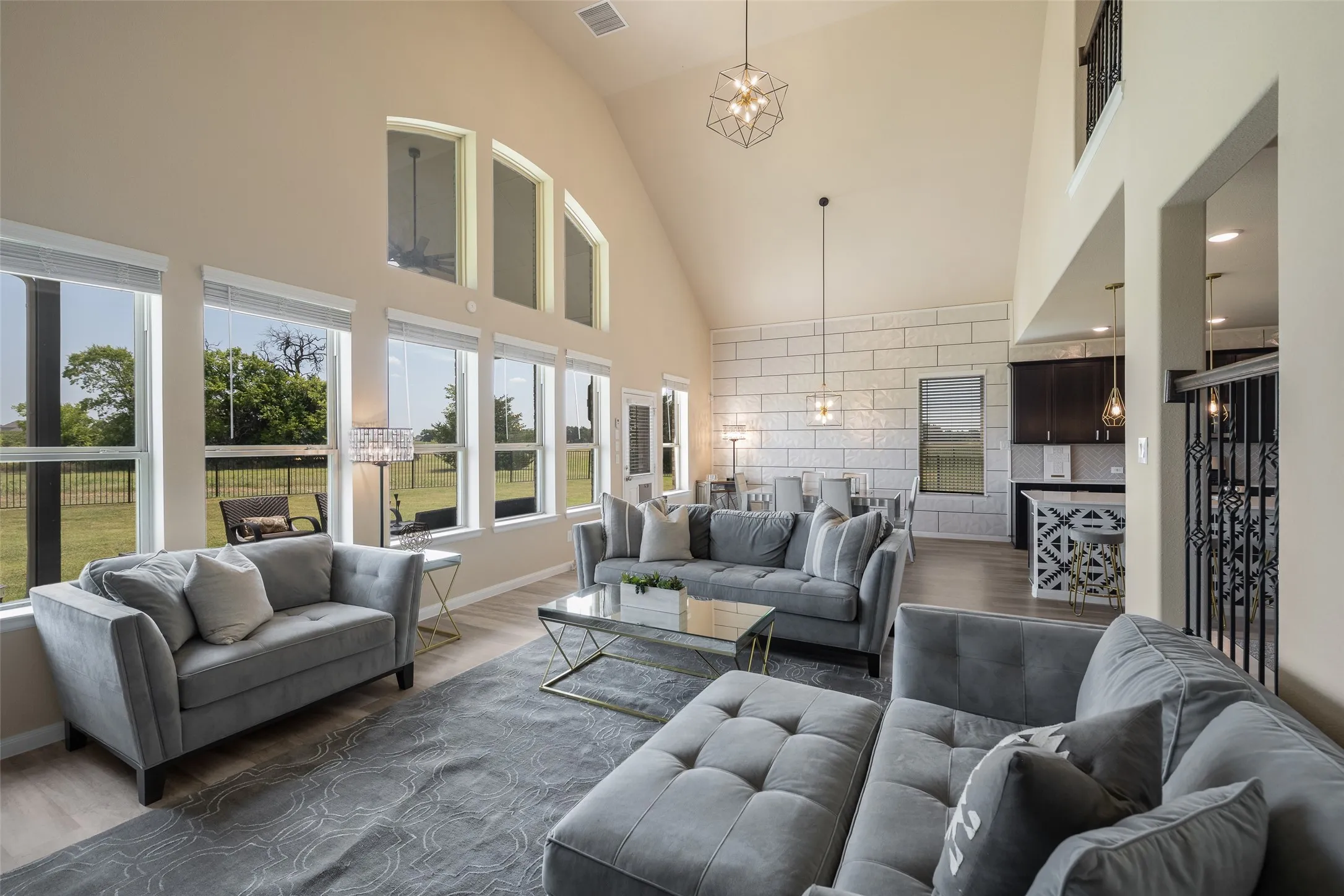 Great view of living room, dining room, and kitchen!