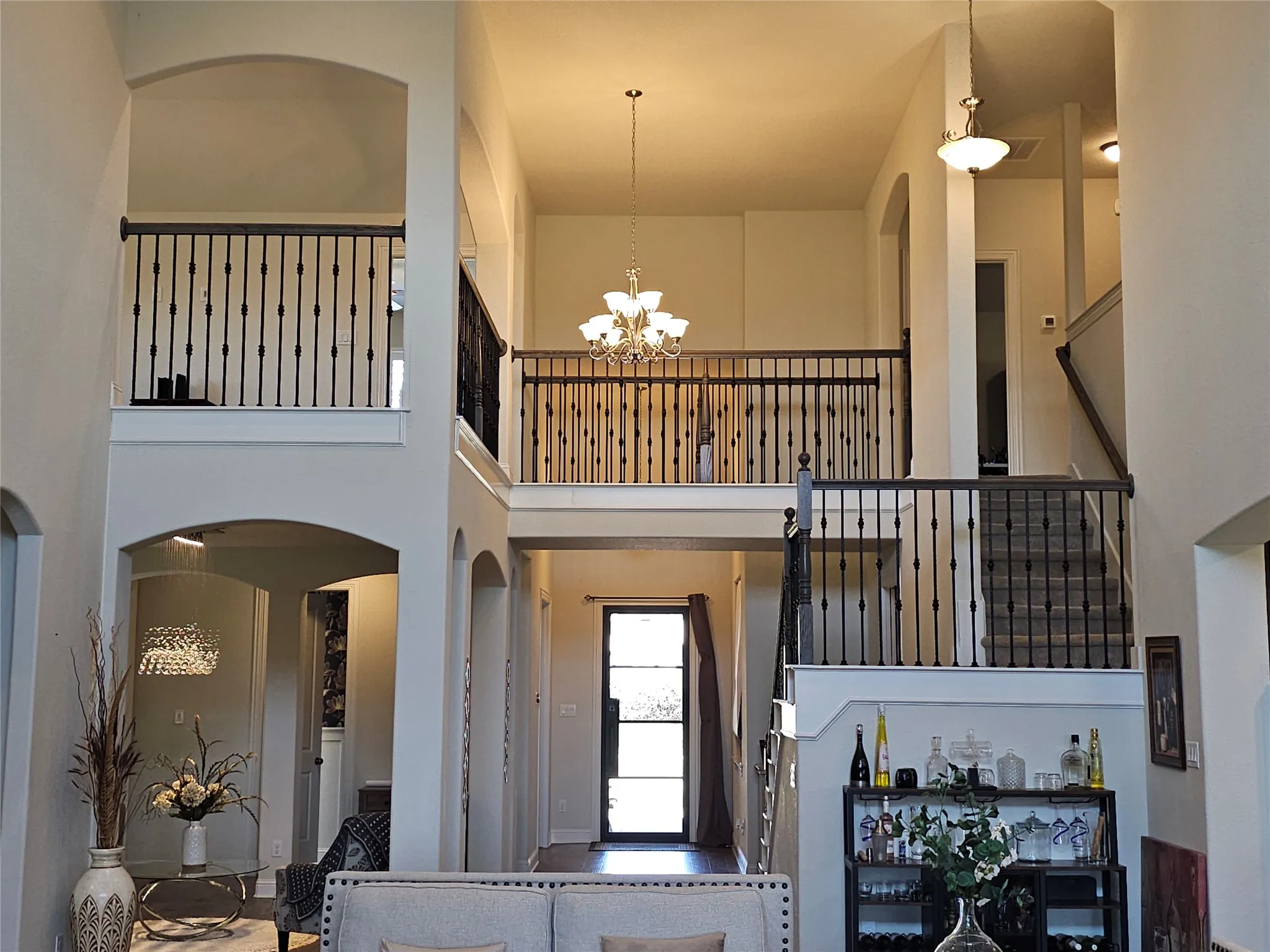 Grand Entryway with Soaring Ceilings & Staircase
