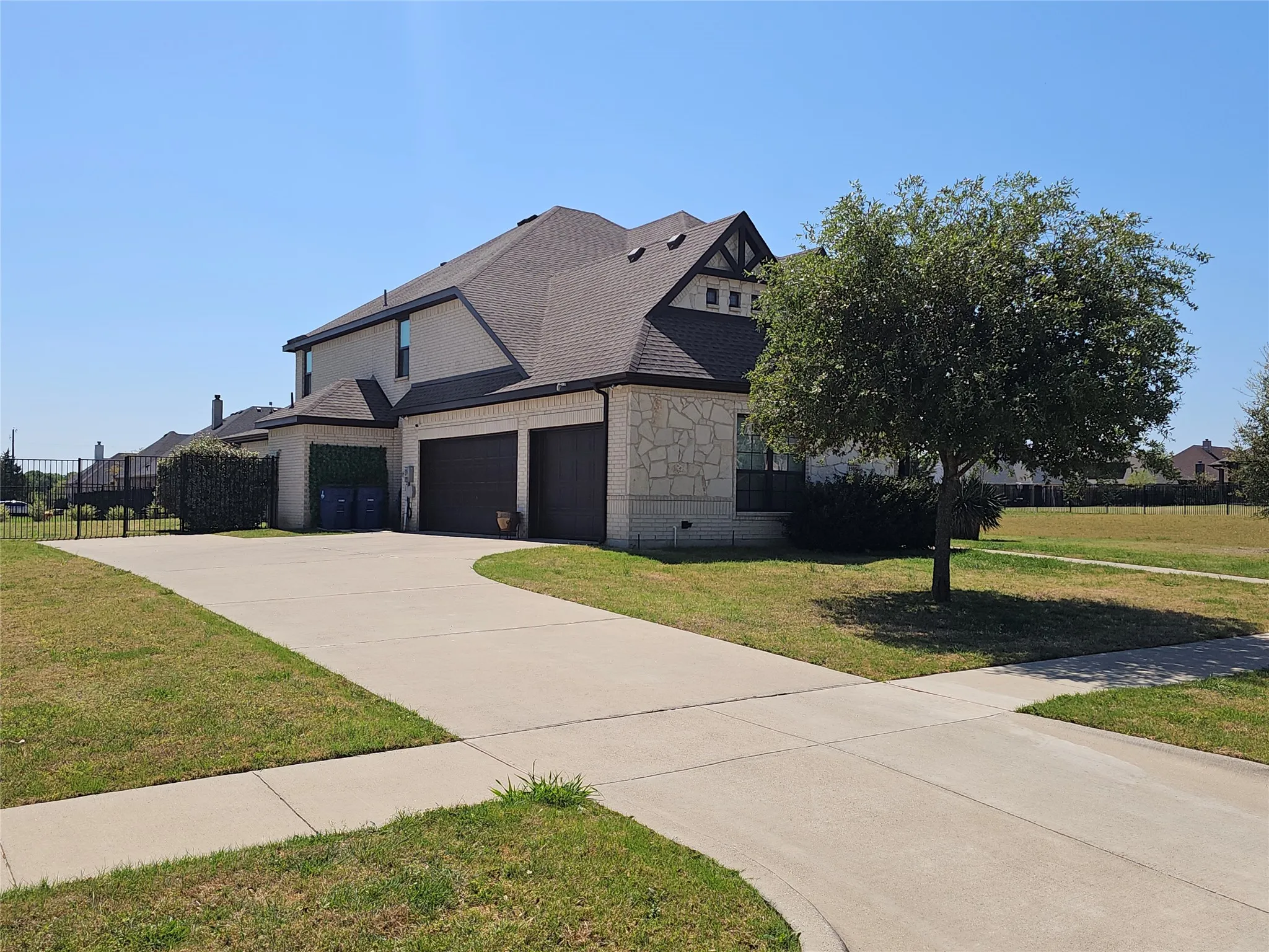 Extended Driveway with 3-Car Garage & Storage Bay