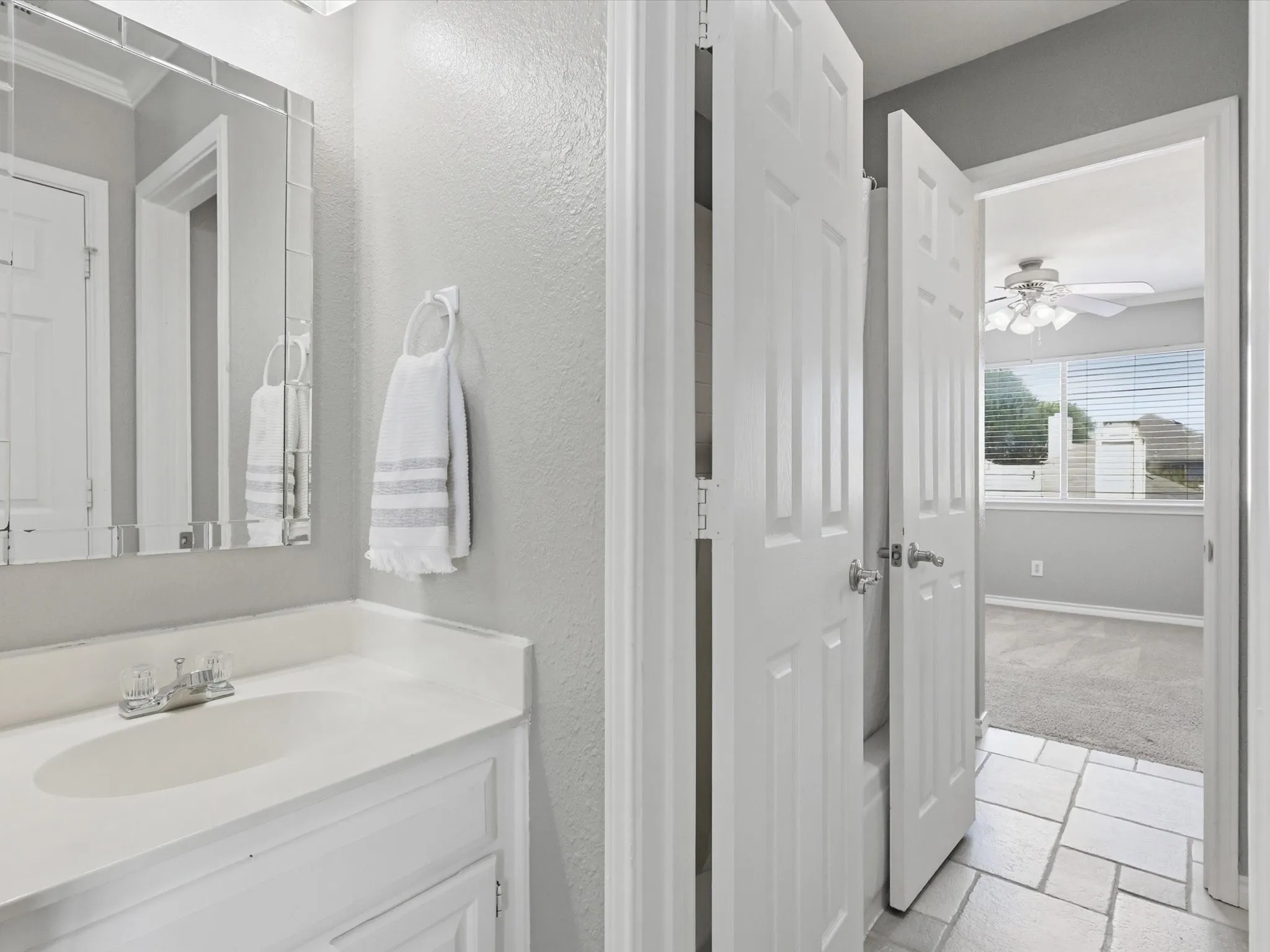 One half of Jack and Jill bath inside a secondary bedroom