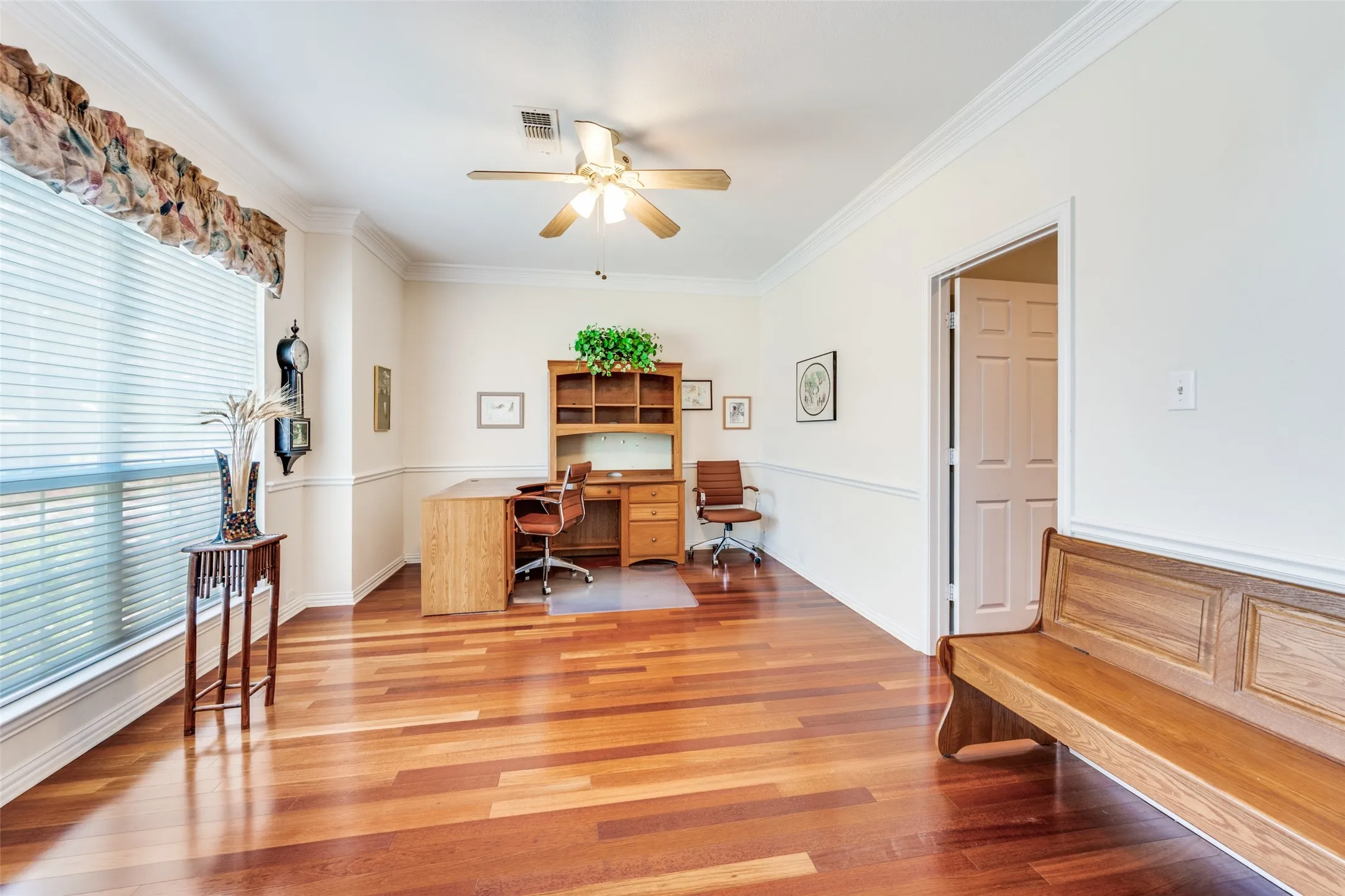 Dining room is currently the home office but is ready for a dining set and lots of great times!  This room is located through the butlers panty and off the foyer opposite one of the three living areas!