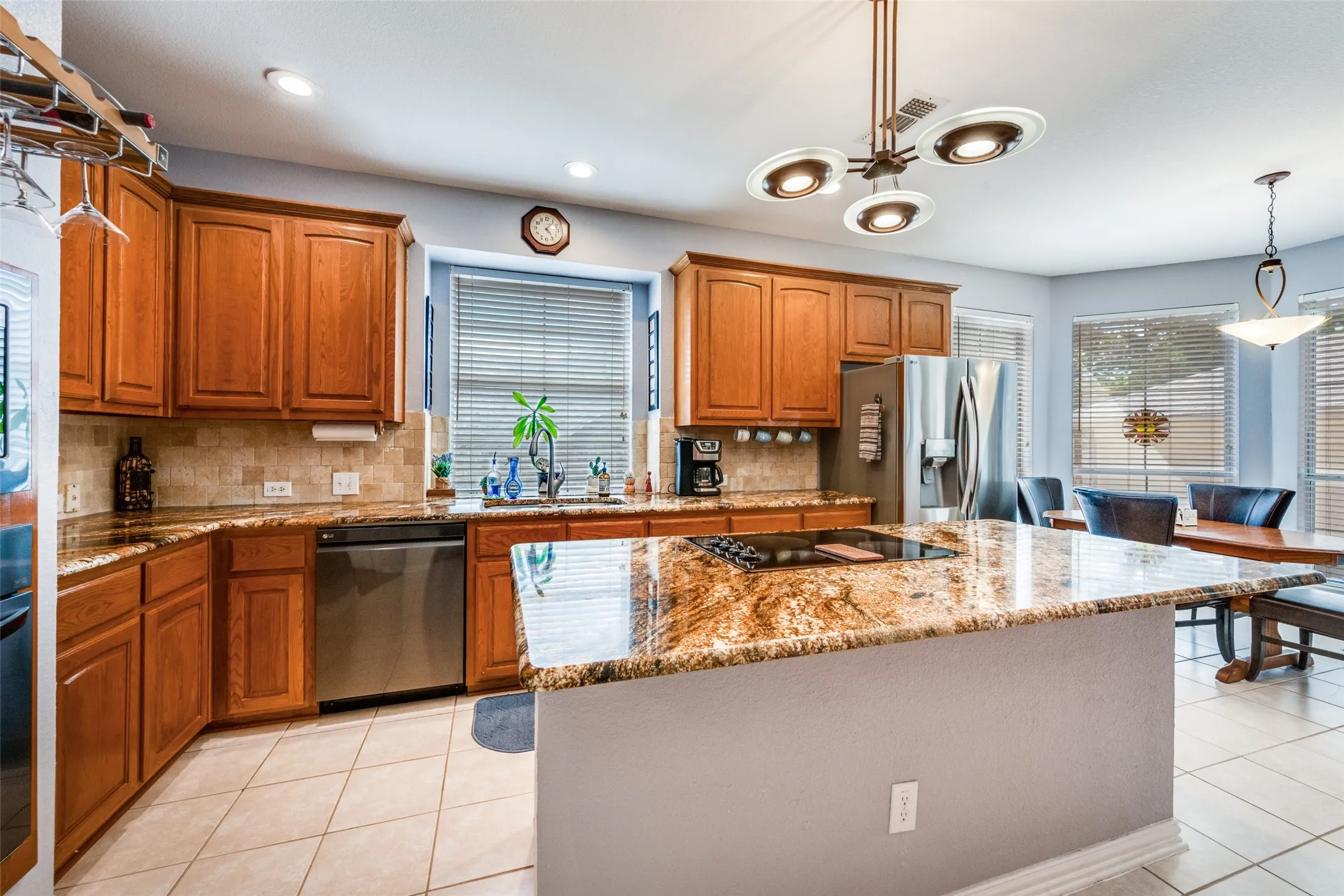 Ceramic tile, recessed lighting, big pantry, island with electricity, window blinds, recent LG appliances!