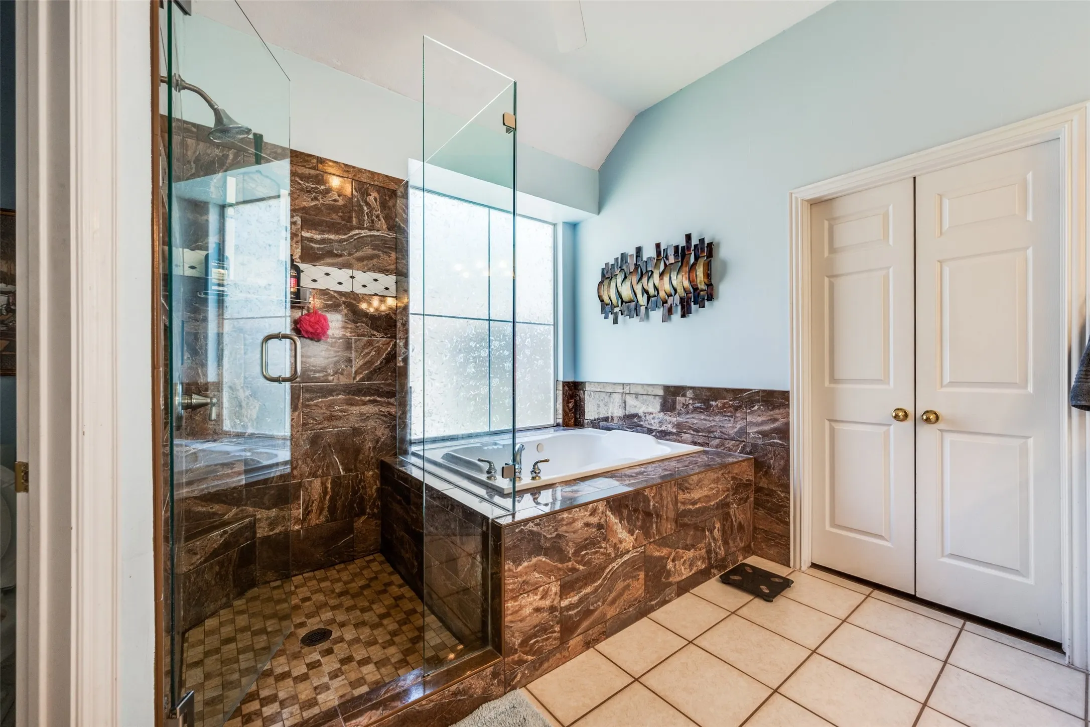 Elegant soaking tub, separate shower and huge walk in closet awaits the homeowner in this suite!