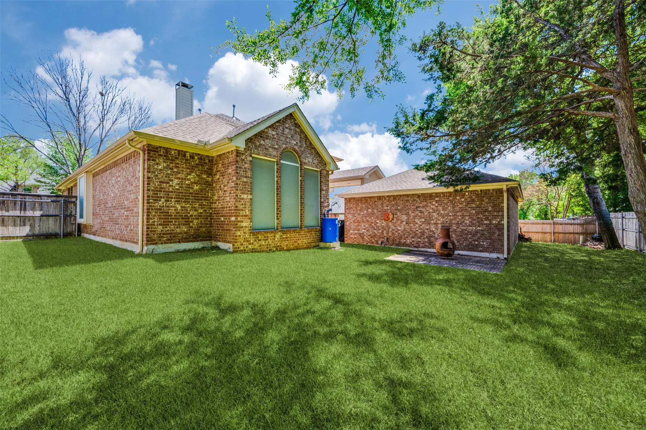 Plenty of yard space for a lap pool and the four legged family members!