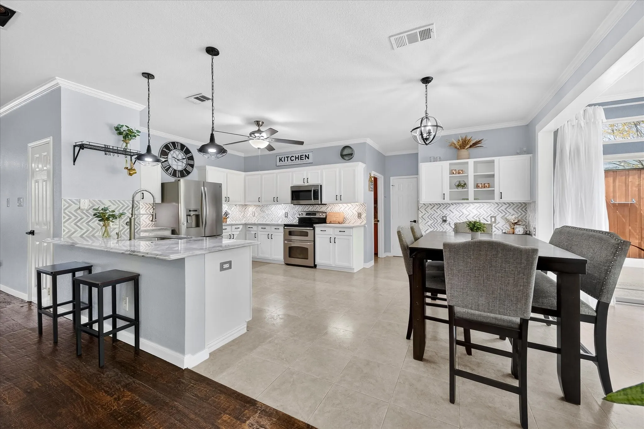 Open floor plan includes chef's dream kitchen opening onto dining area and family room