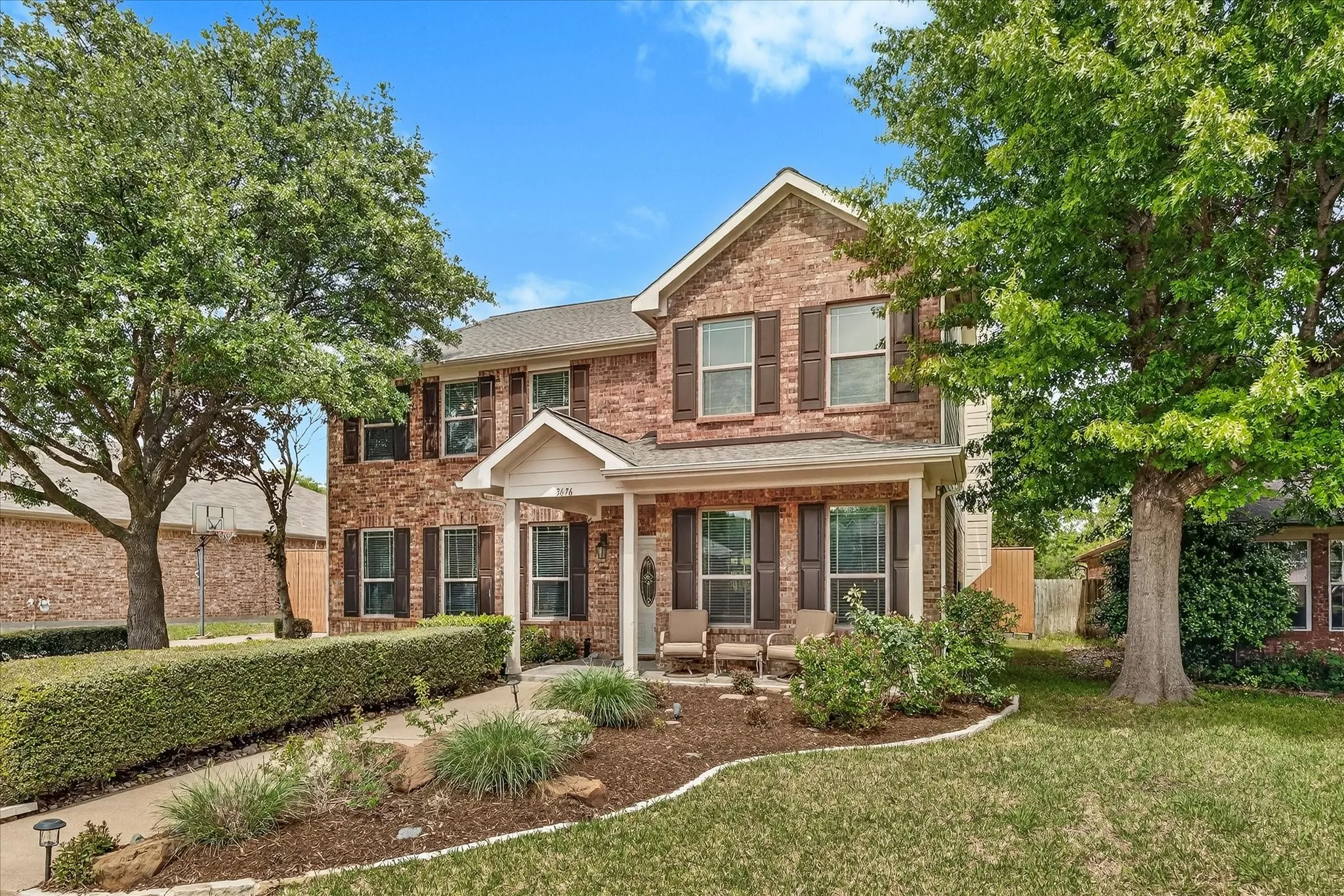 Lovely covered porch adds to this home's charming curb appeal.