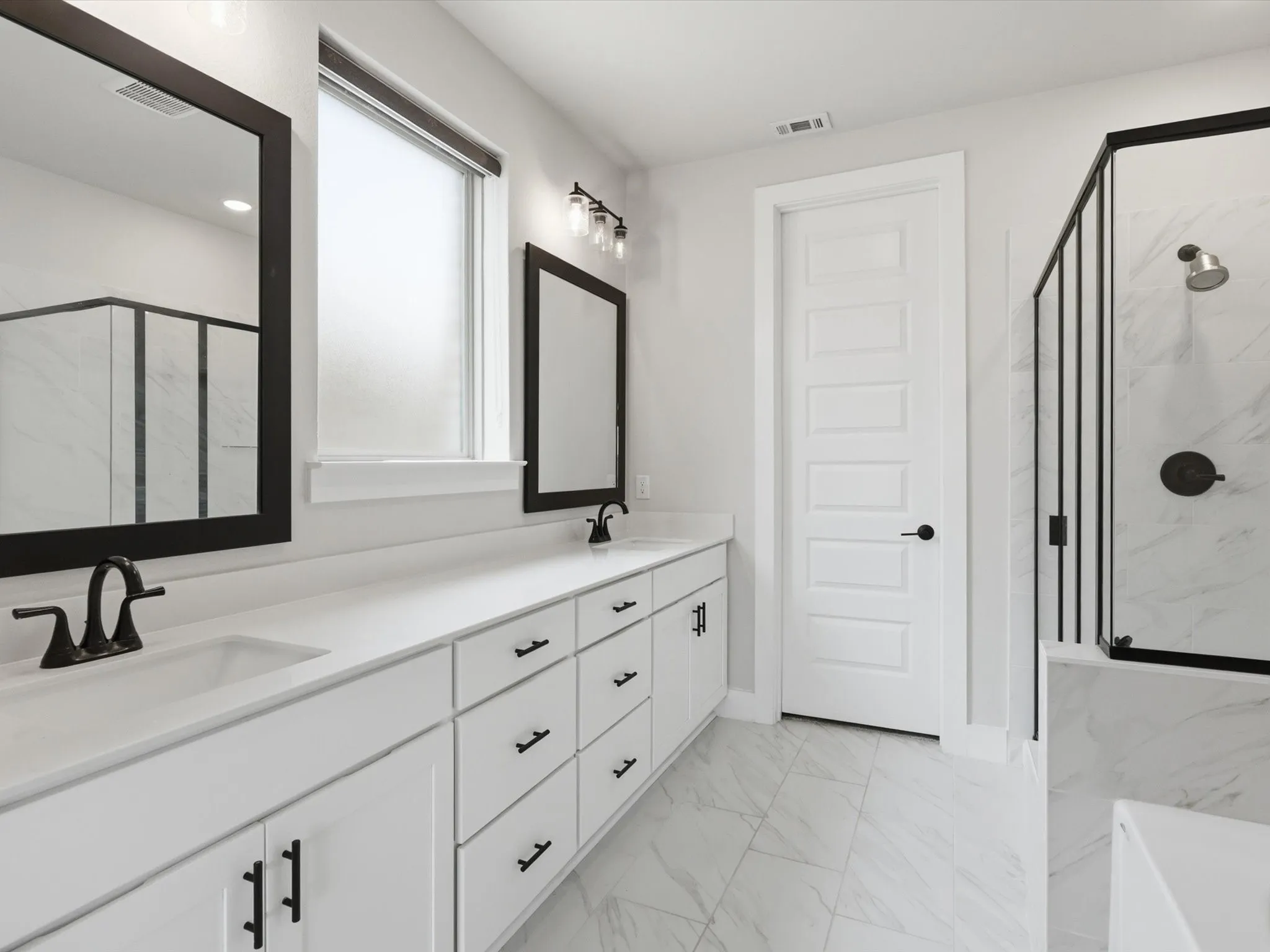 ensuite bath showcasing sleek modern finishes and extended vanity
