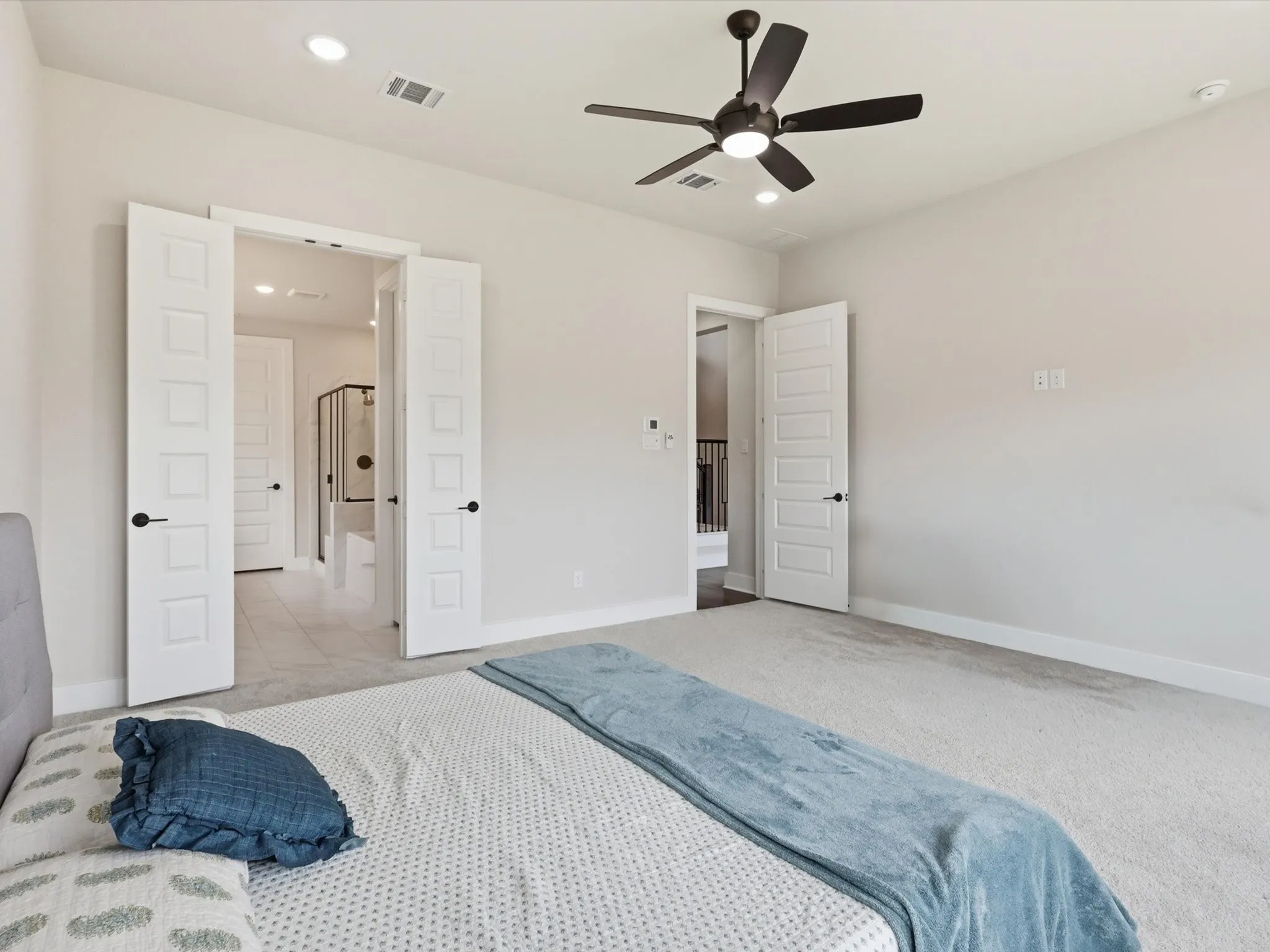 Extended primary suite flooded with natural light