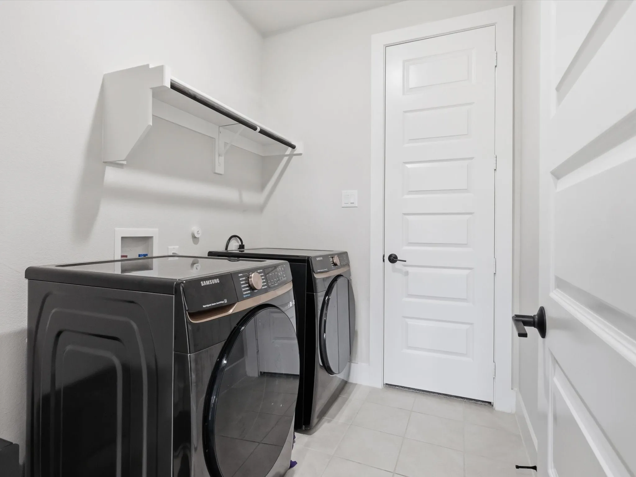 Laundry Room thats connected to primary closet