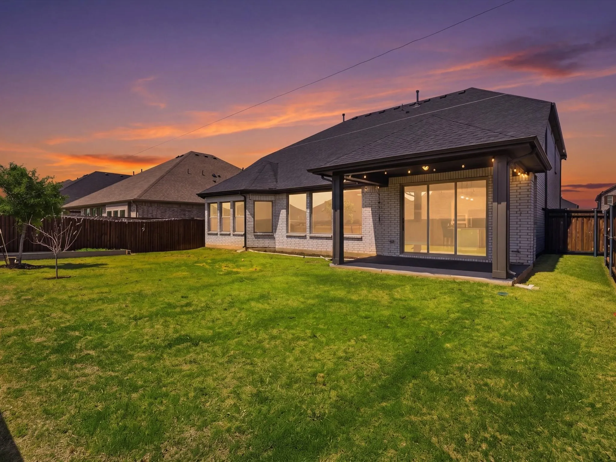Covered patio perfect for relaxing or hosting guests. Twilight Enhanced