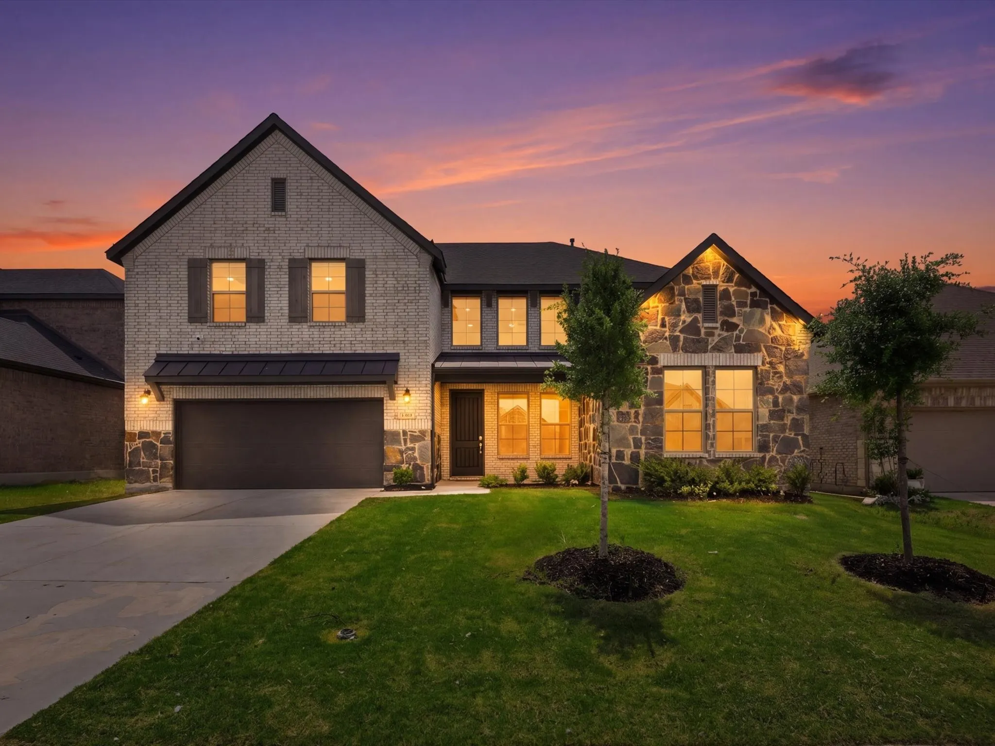 Beautiful curb appeal with modern brick and stone elevation