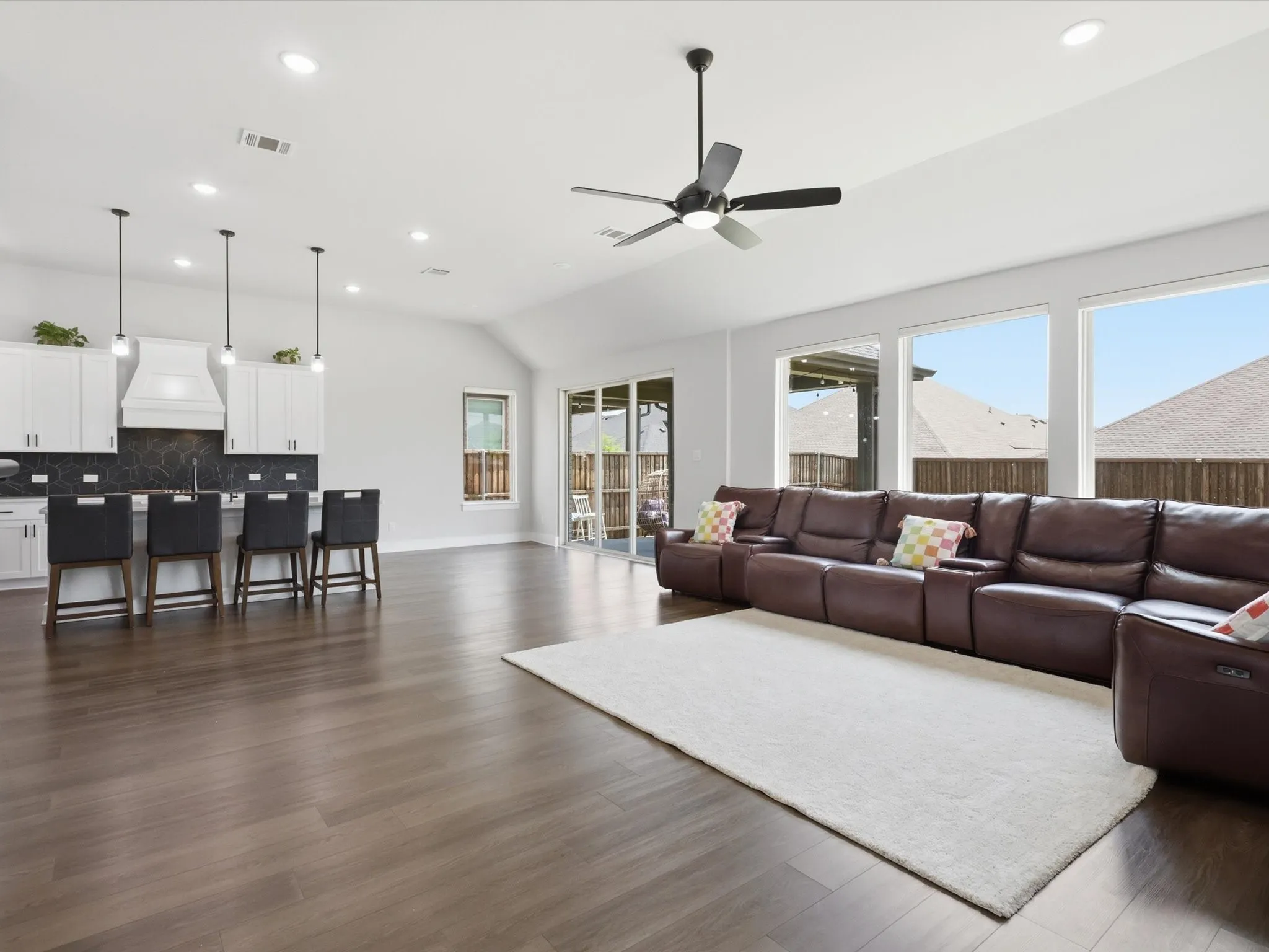 Bright and airy main living space with backyard views