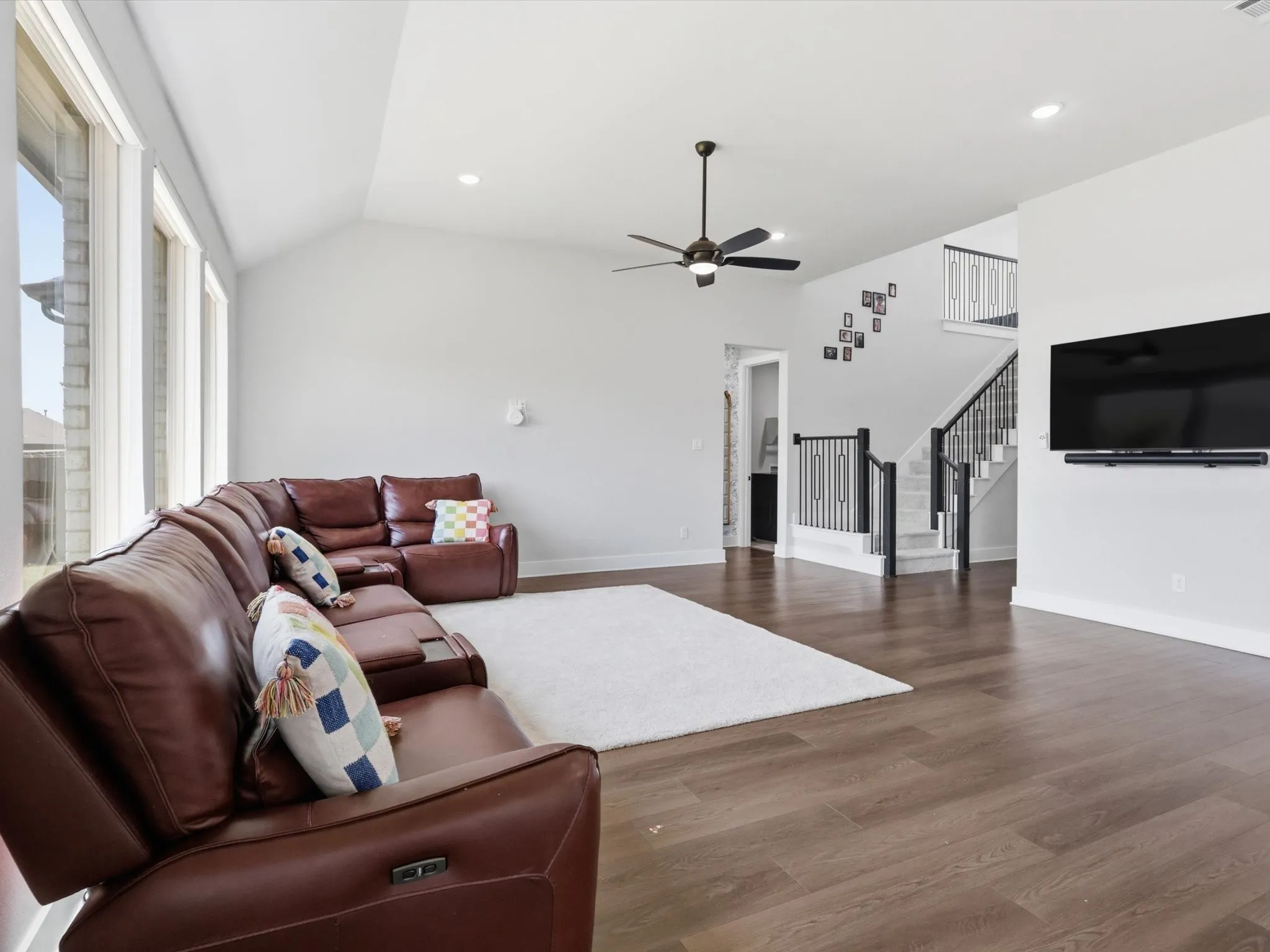 Open living room with soaring ceilings and expansive windows